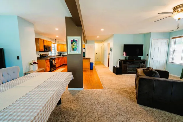 a bedroom with furniture and a flat screen tv