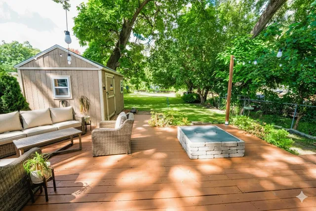 a view of a house with backyard and a garden