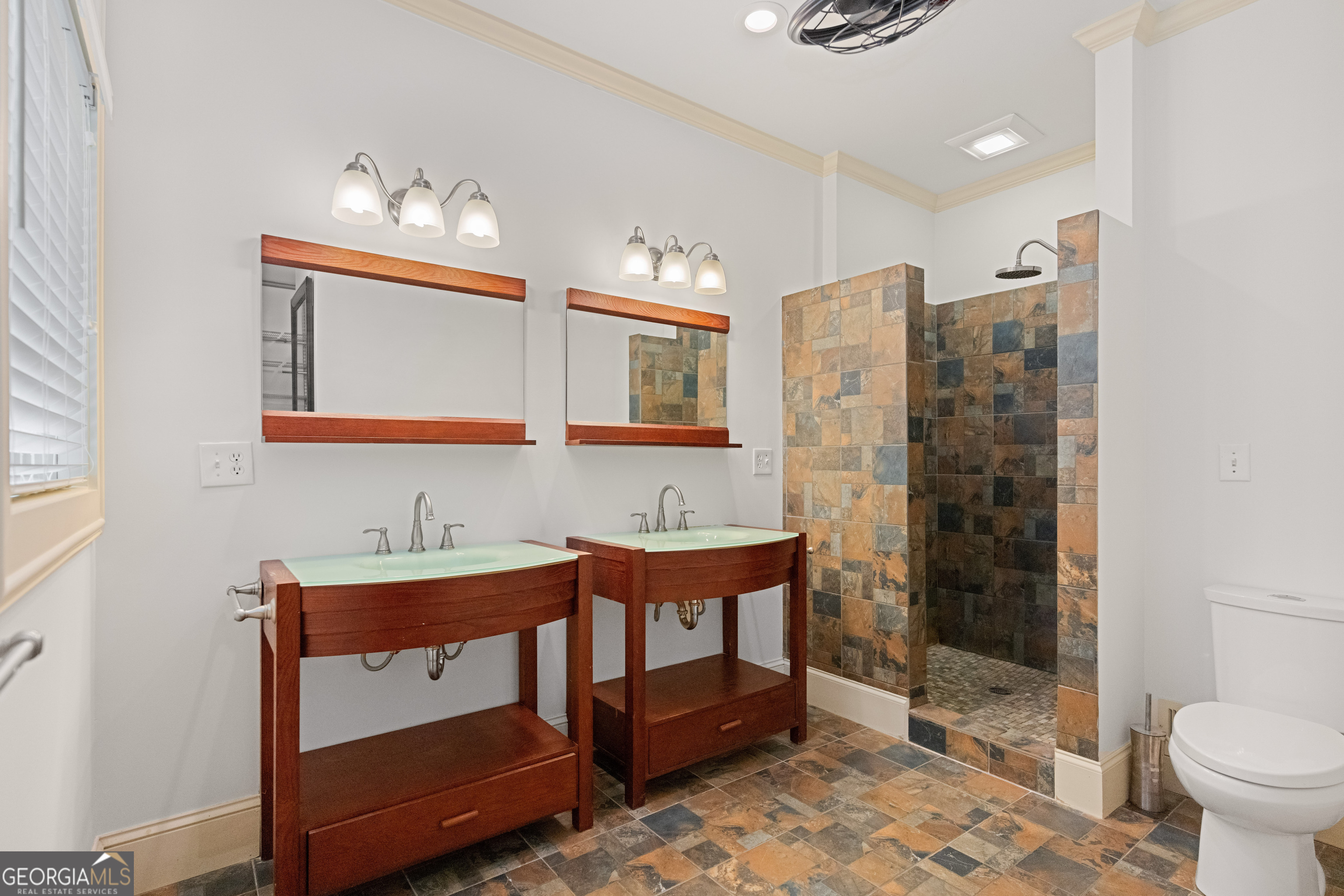 1010 Plum Orchard Road Greensboro, GA 30642 - Photo 21 of 85 a bathroom with a sink mirror and a toilet
