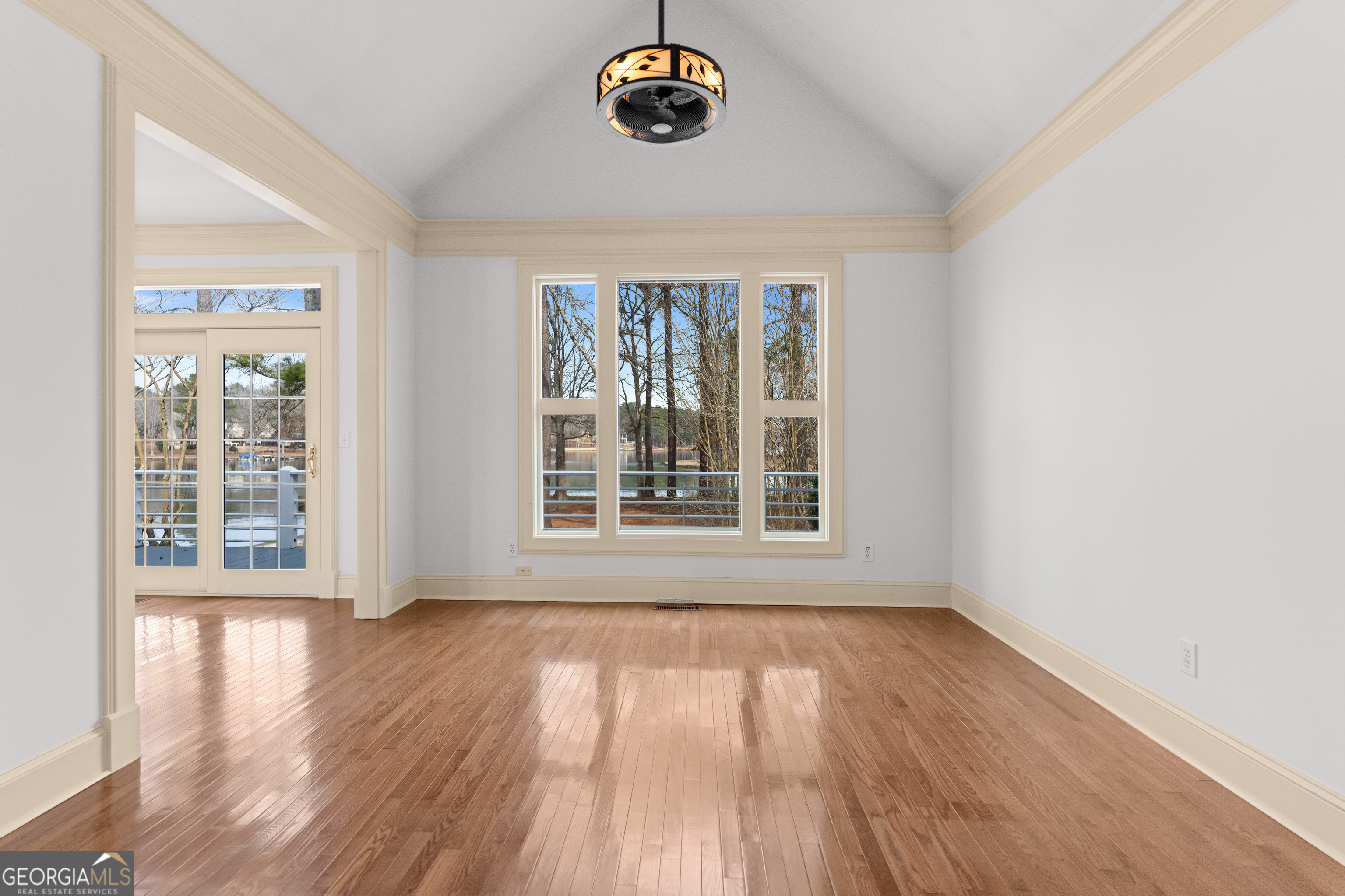 1010 Plum Orchard Road Greensboro, GA 30642 - Photo 27 of 85 an empty room with wooden floor and windows