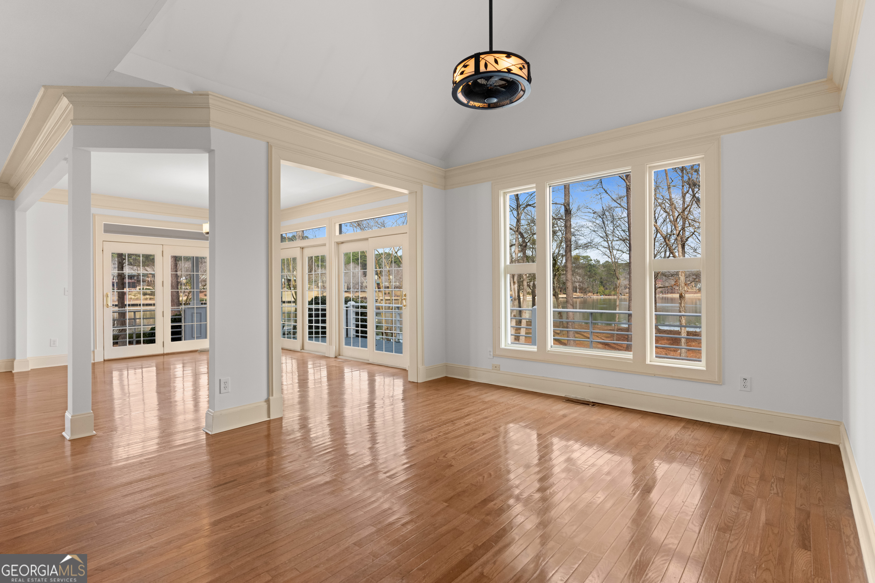 1010 Plum Orchard Road Greensboro, GA 30642 - Photo 29 of 85 an empty room with wooden floor and windows