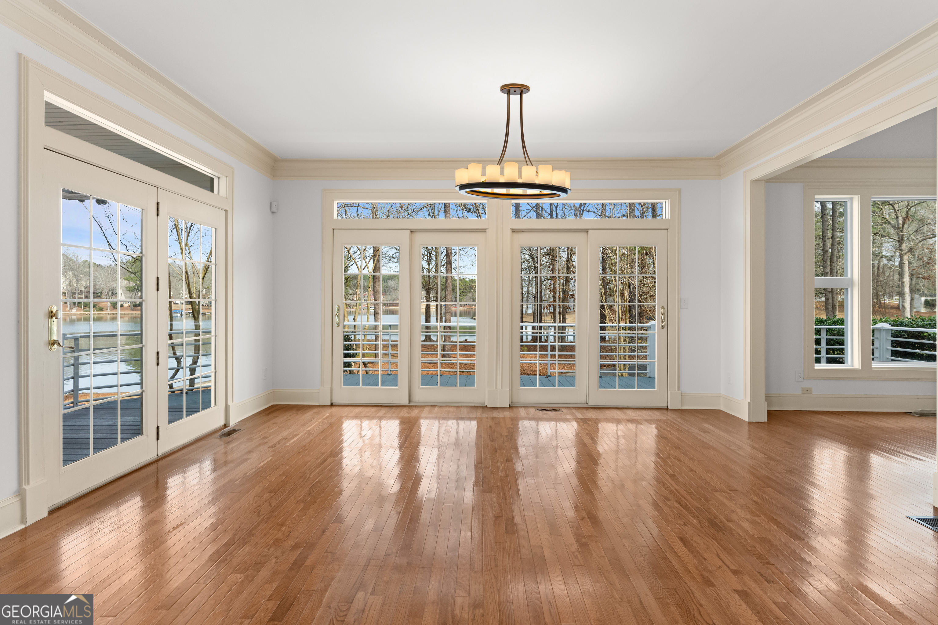1010 Plum Orchard Road Greensboro, GA 30642 - Photo 31 of 85 a view of an empty room with wooden floor and a window
