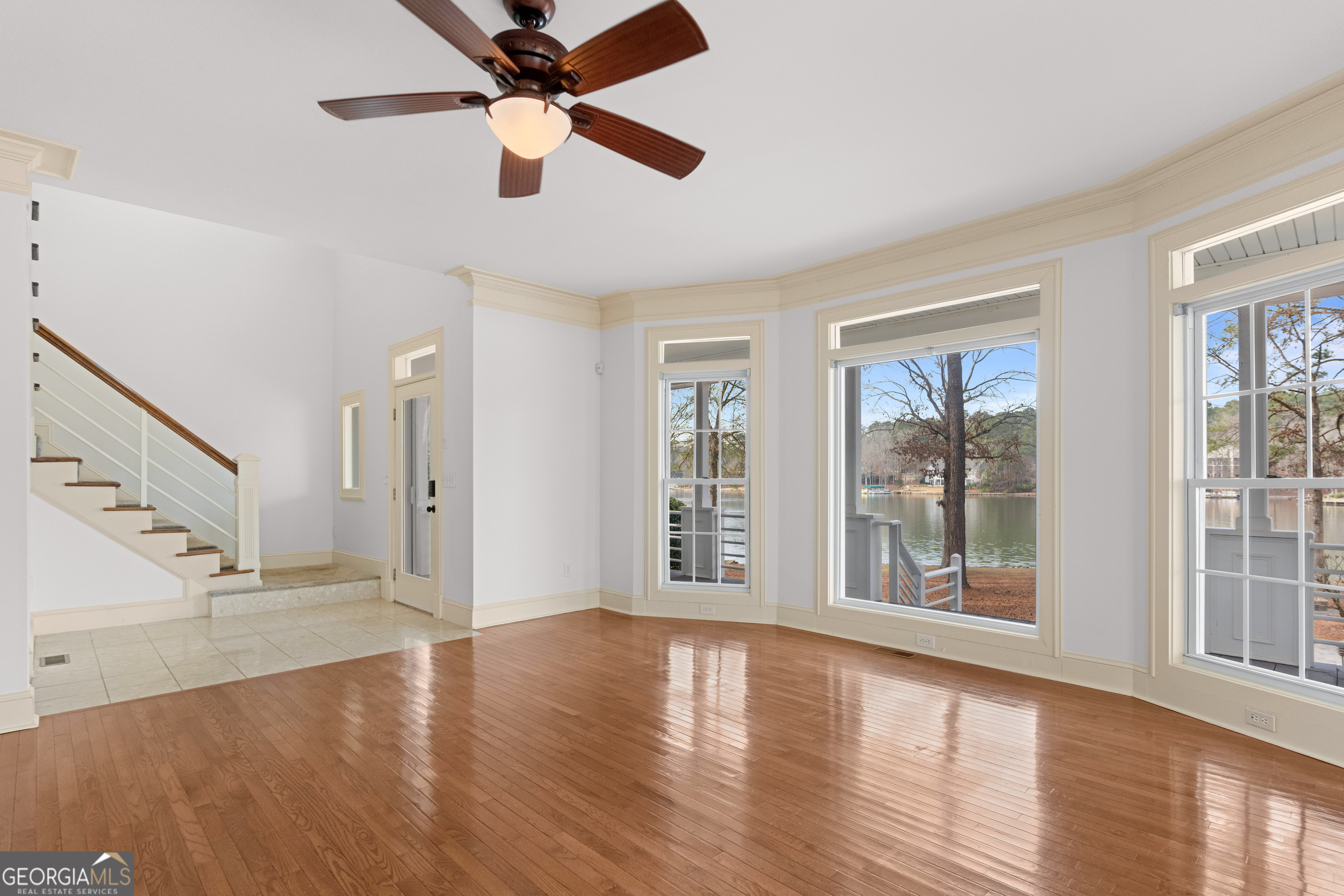 1010 Plum Orchard Road Greensboro, GA 30642 - Photo 38 of 85 a view of an empty room with wooden floor and a window