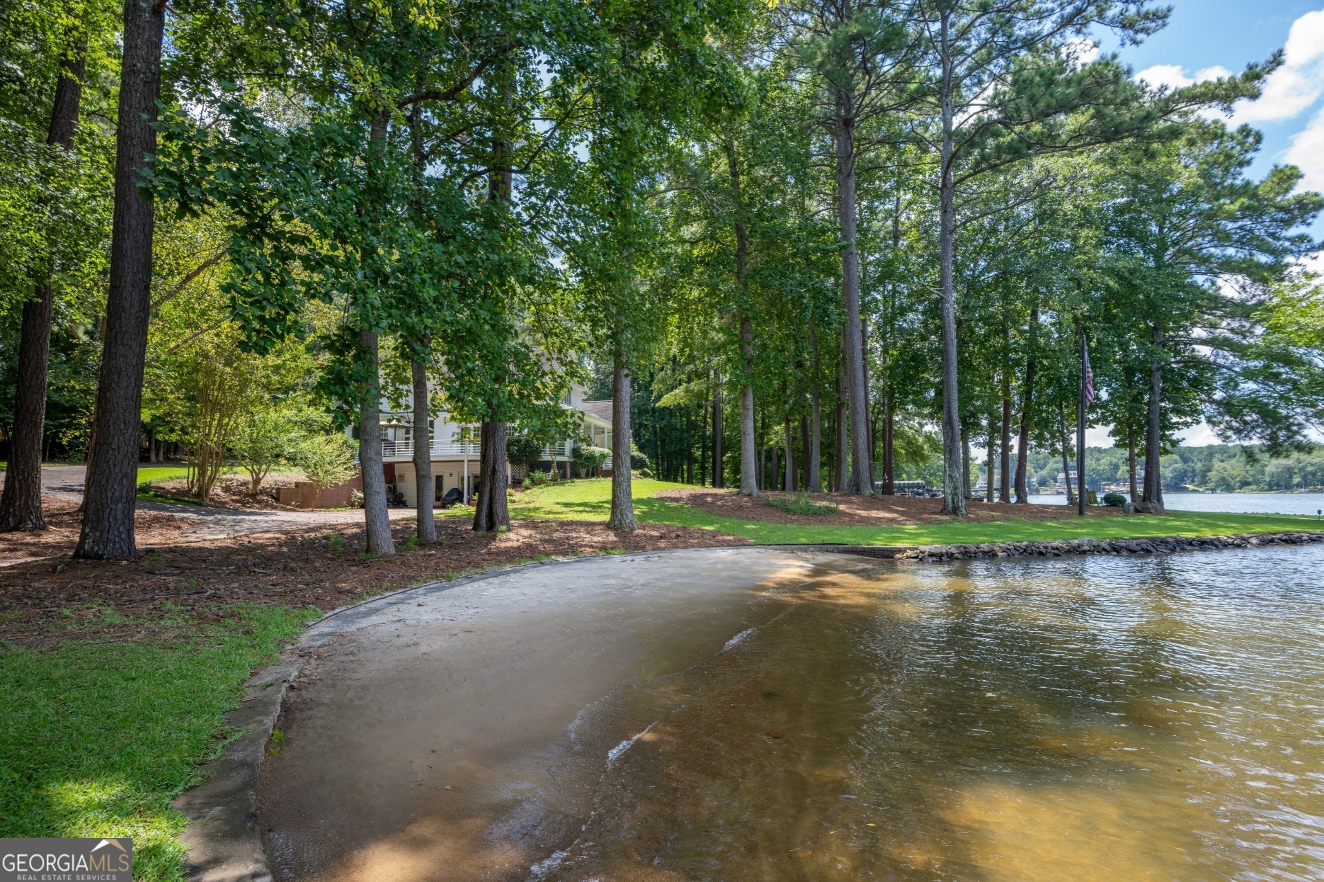 1010 Plum Orchard Road Greensboro, GA 30642 - Photo 4 of 85 a view of a swimming pool with a table and chairs in the patio