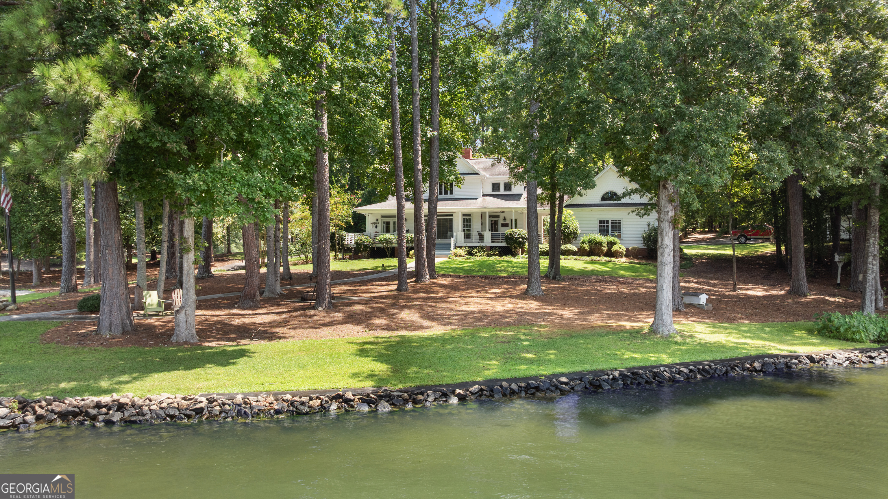 1010 Plum Orchard Road Greensboro, GA 30642 - Photo 41 of 85 a swimming pool with outdoor seating and yard