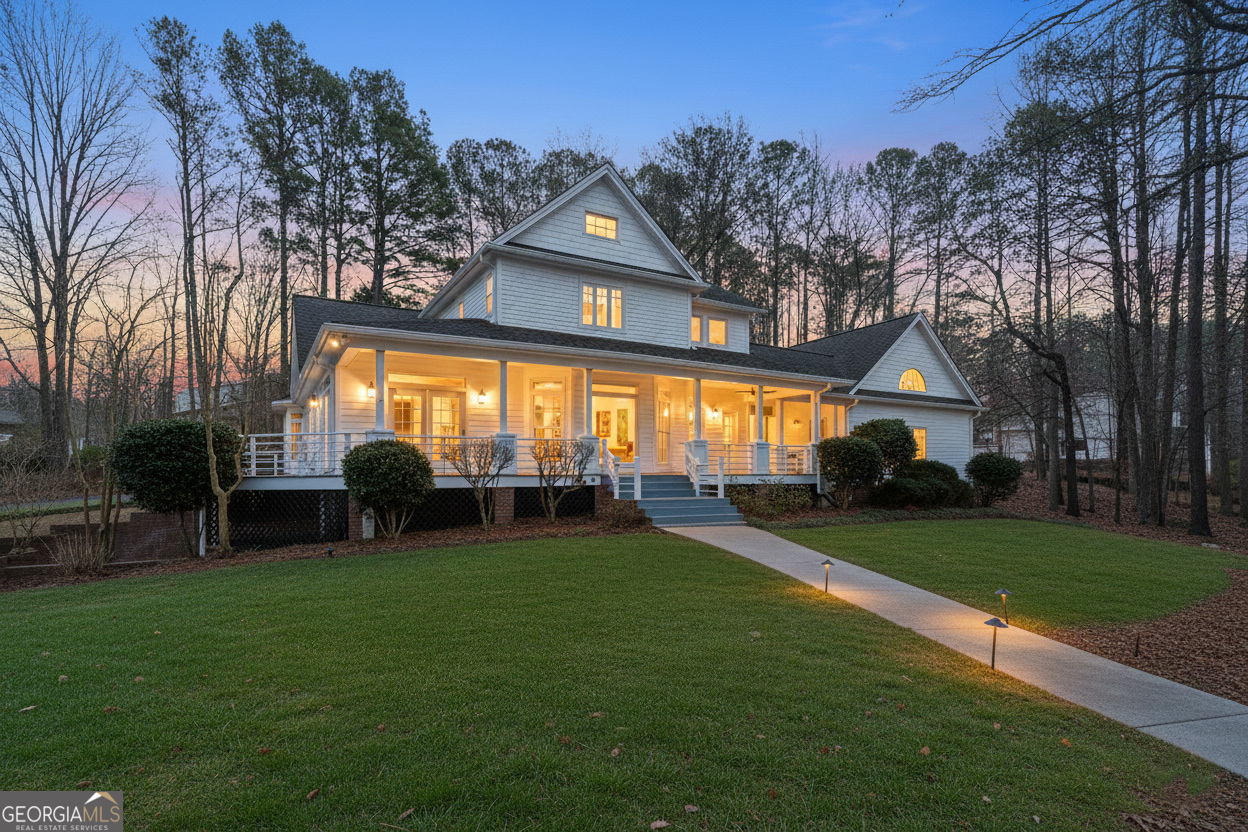 1010 Plum Orchard Road Greensboro, GA 30642 - Photo 6 of 85 a view of house with a big yard and large trees