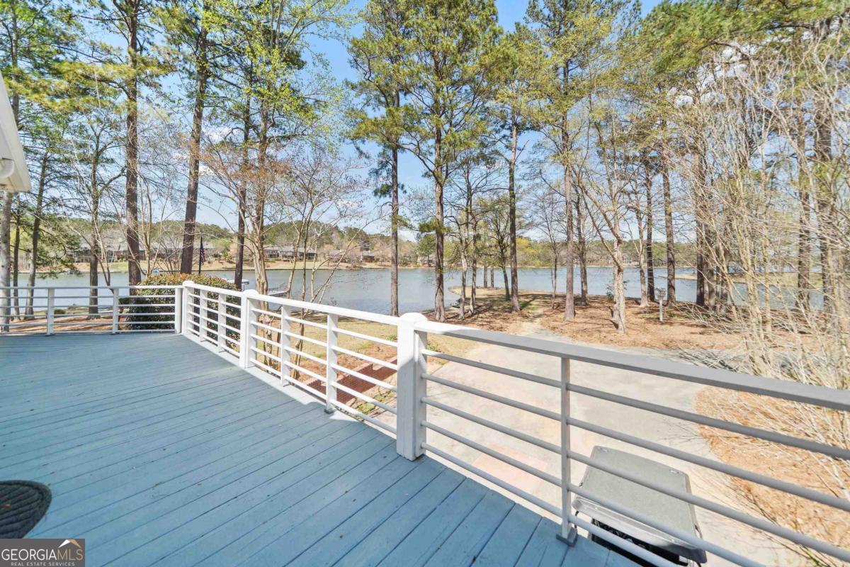 1010 Plum Orchard Road Greensboro, GA 30642 - Photo 76 of 85 a view of outdoor space with deck and a garden