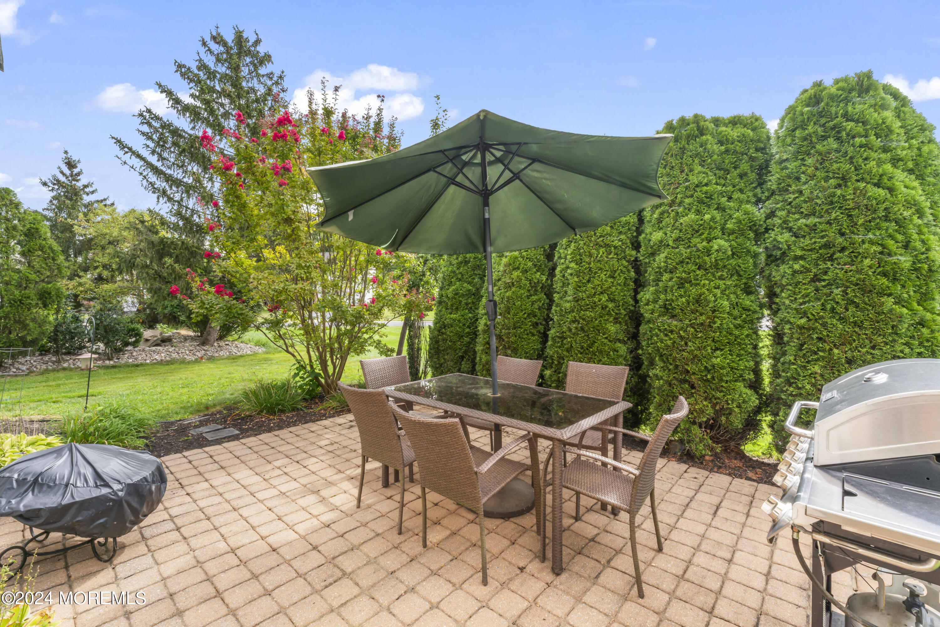 25 Sandstone Road East Windsor, NJ 08520 - Photo 26 of 33 a view of yard with seating area and green space