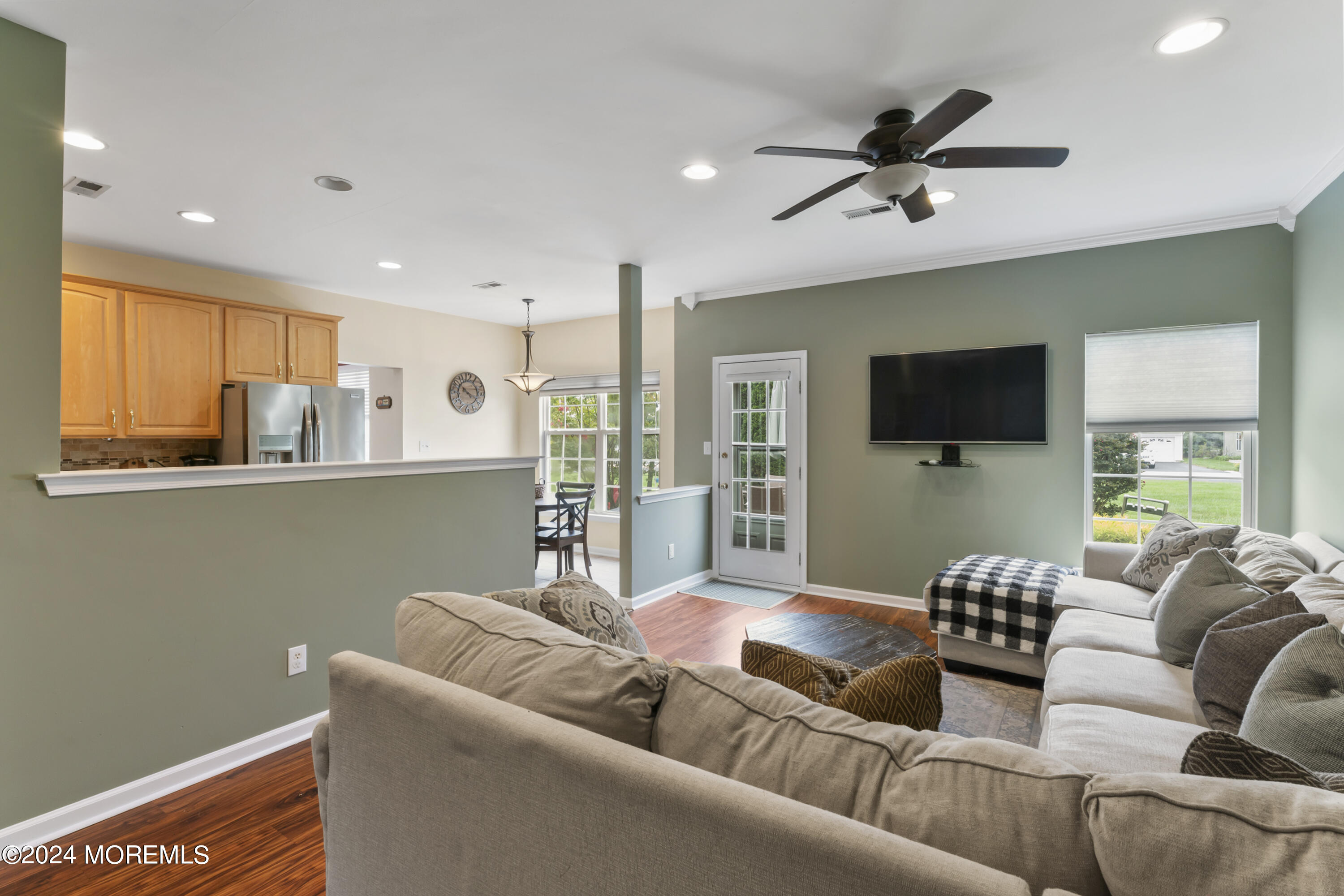 25 Sandstone Road East Windsor, NJ 08520 - Photo 8 of 33 a living room with furniture and a flat screen tv