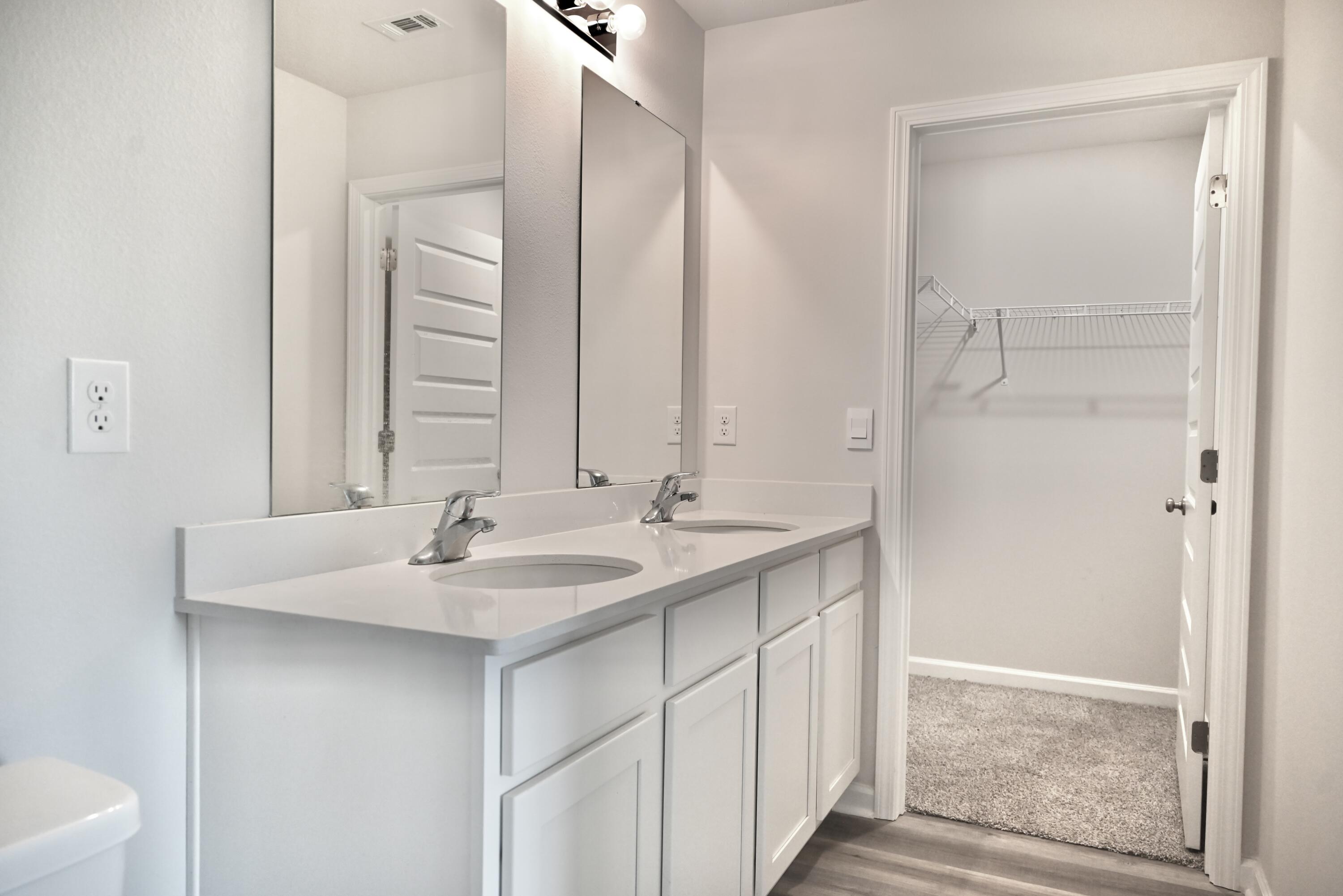 429 Scarborough Street Crestview, FL 32539 - Photo 23 of 30 a bathroom with a sink and a mirror