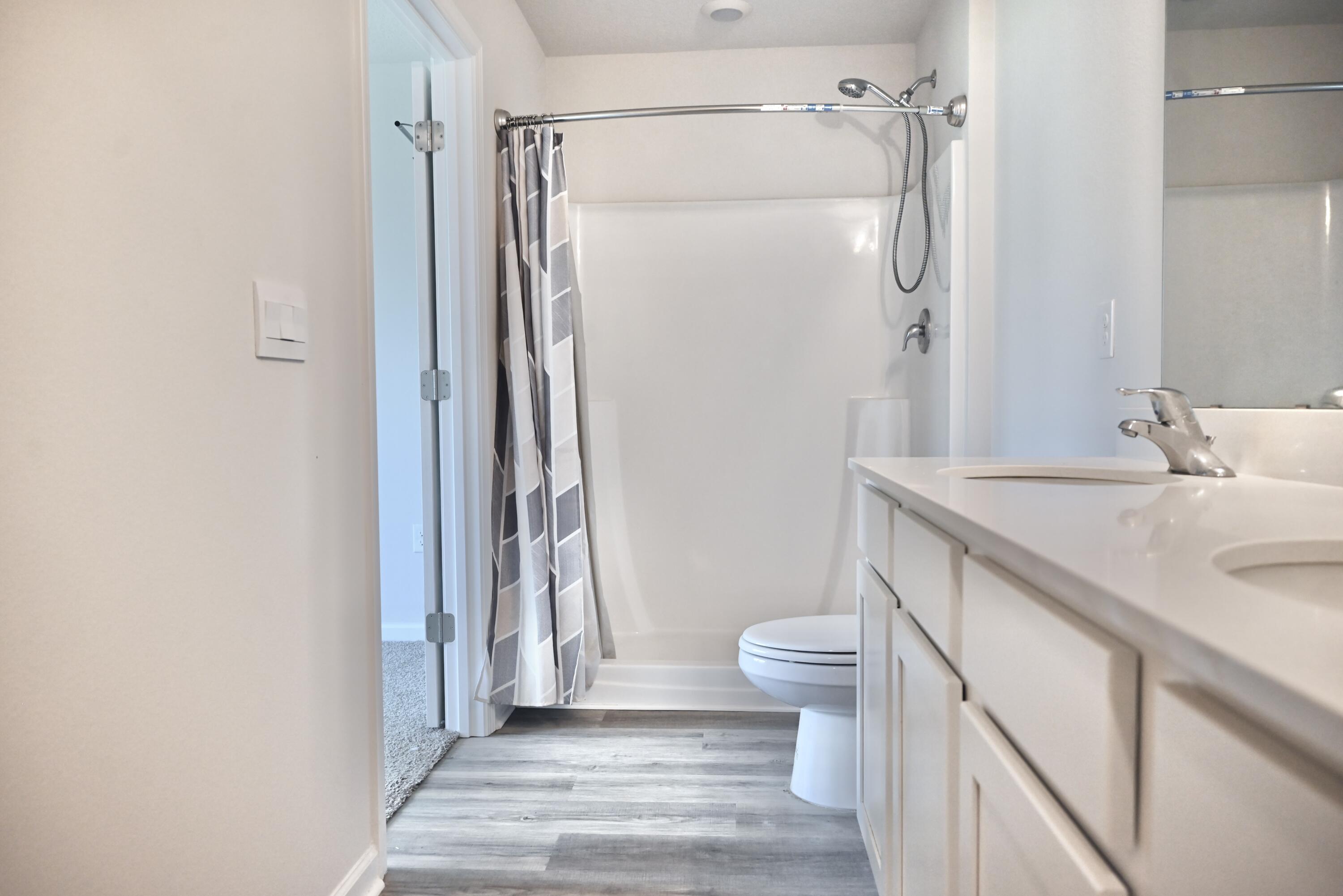 429 Scarborough Street Crestview, FL 32539 - Photo 25 of 30 a bathroom with a sink a toilet and shower