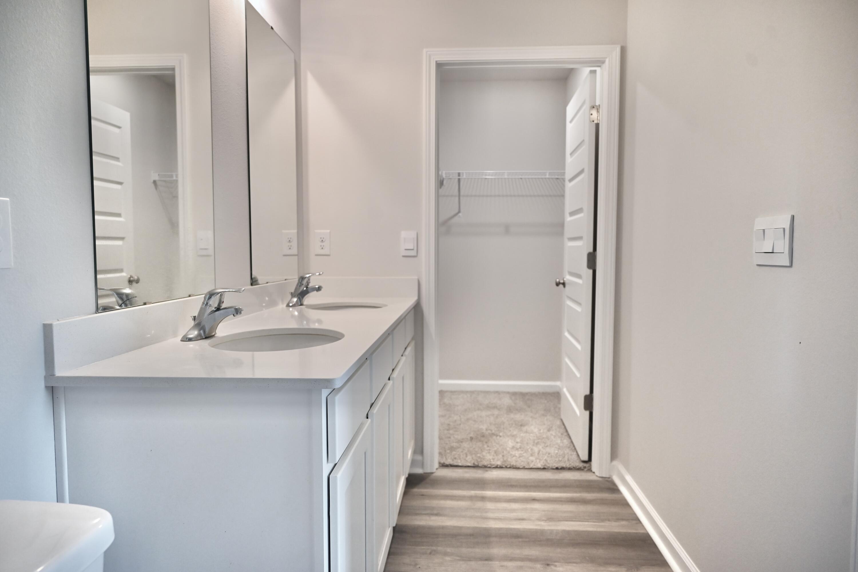 429 Scarborough Street Crestview, FL 32539 - Photo 26 of 30 a bathroom with a sink and a mirror