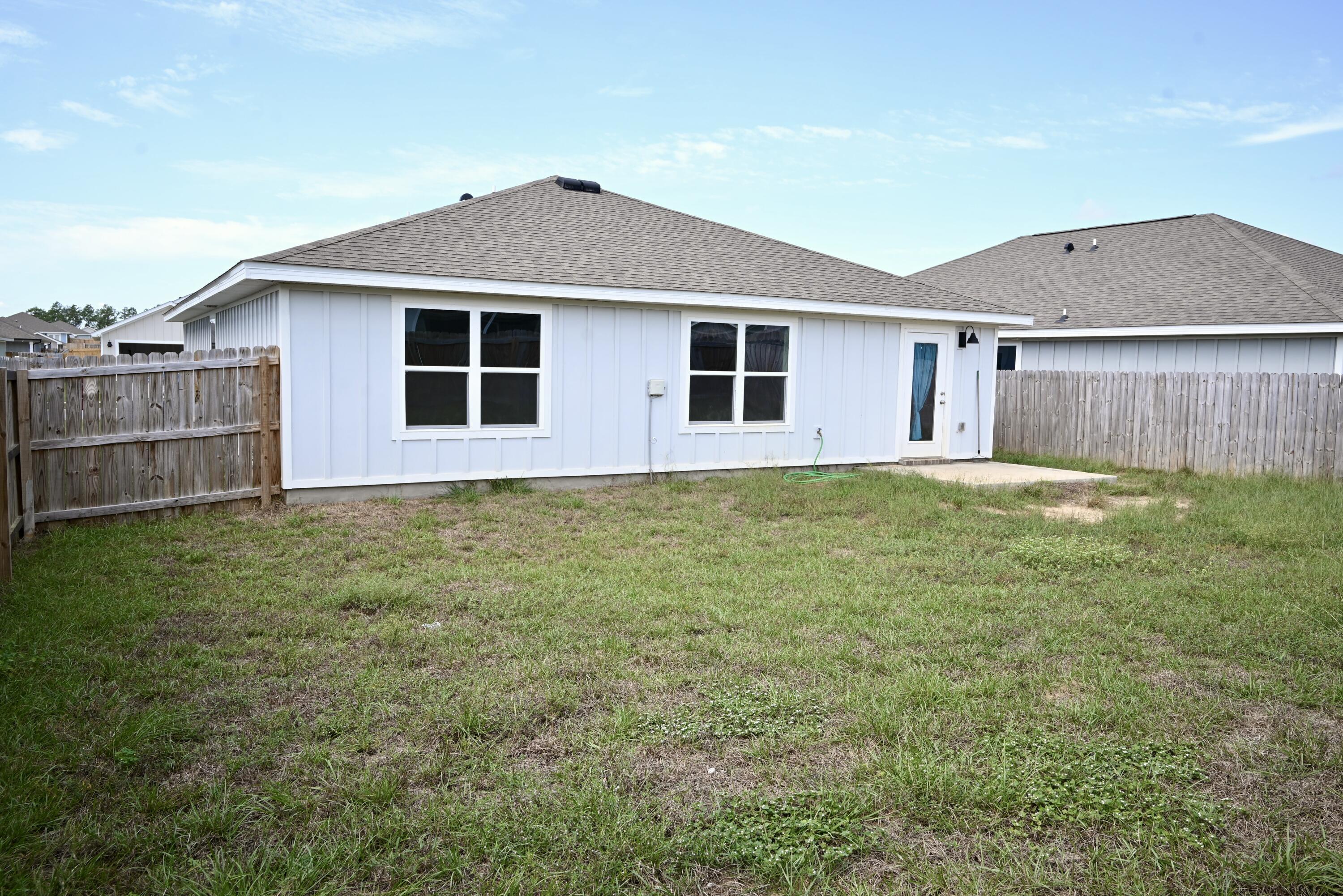 429 Scarborough Street Crestview, FL 32539 - Photo 28 of 30 a house view with a garden space