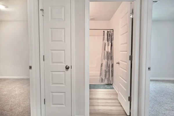 a view of a bathroom from the hallway