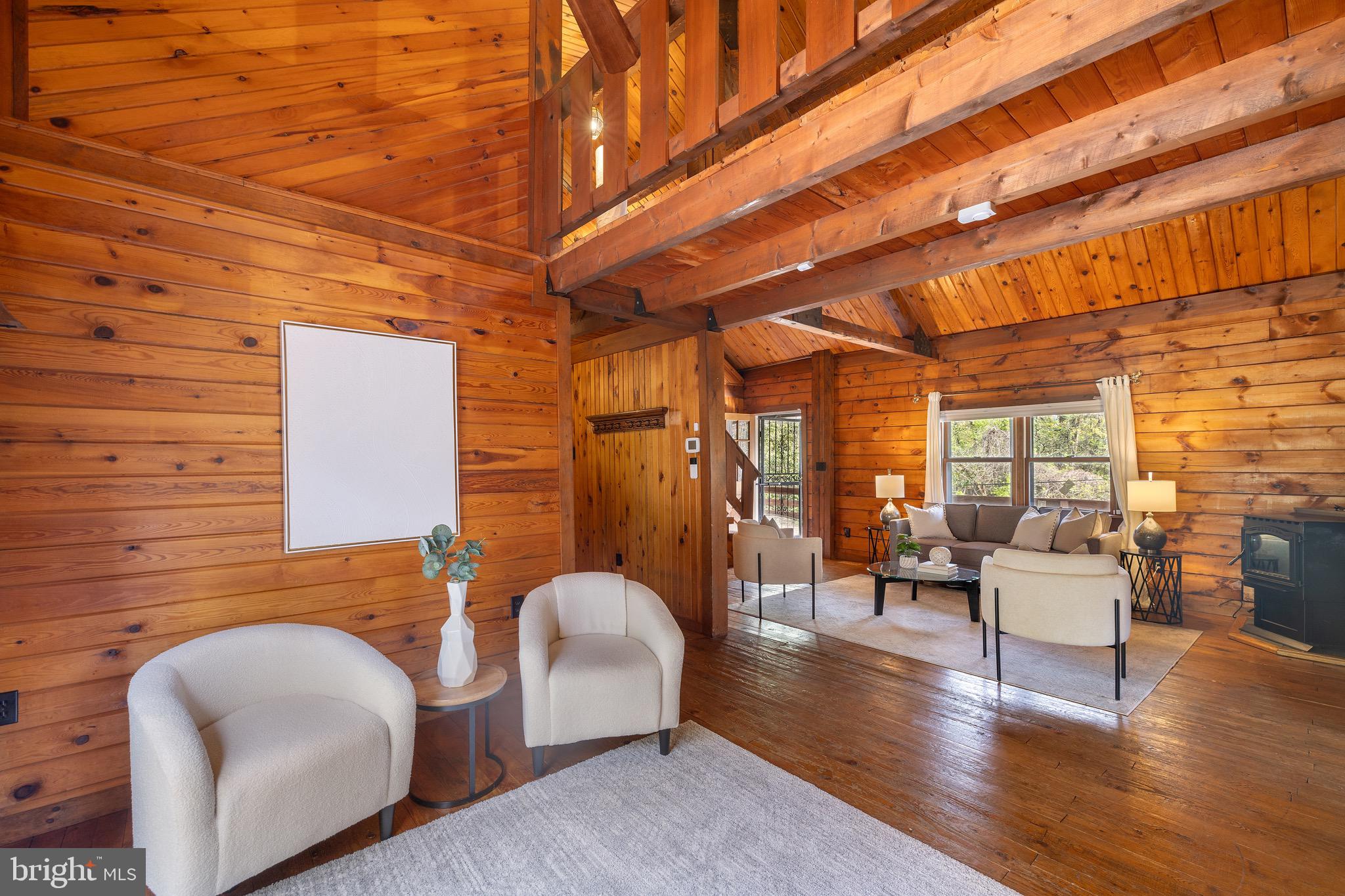 6402 Otis Street Cheverly, MD 20785 - Photo 12 of 52 a balcony with furniture and wooden floor