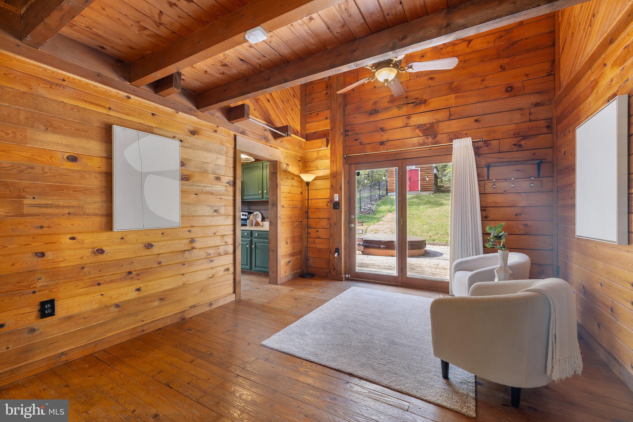 6402 Otis Street Cheverly, MD 20785 - Photo 13 of 52 a spacious bedroom with a bed and wooden floor