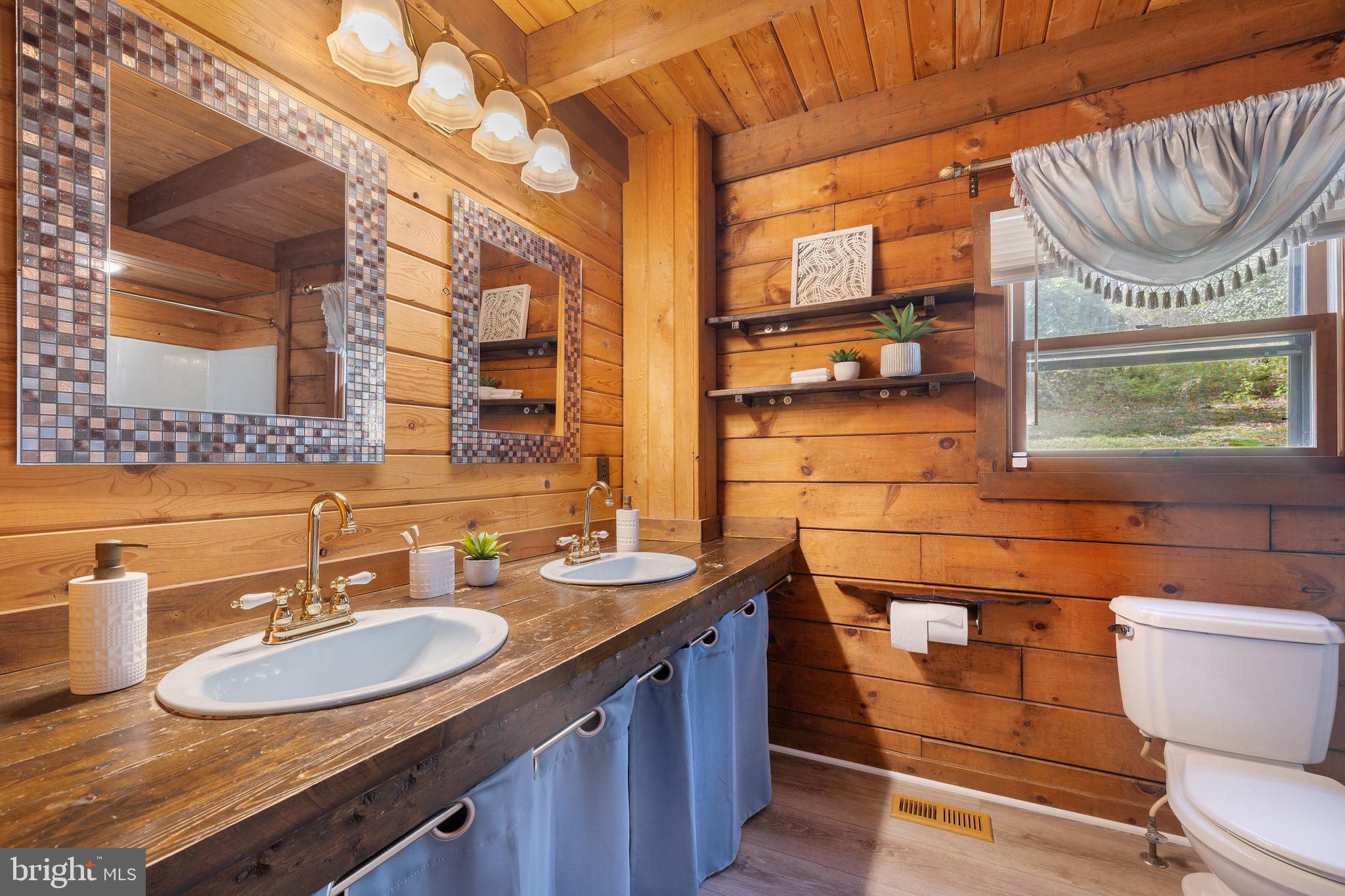 6402 Otis Street Cheverly, MD 20785 - Photo 14 of 52 a bathroom with a sink and a mirror