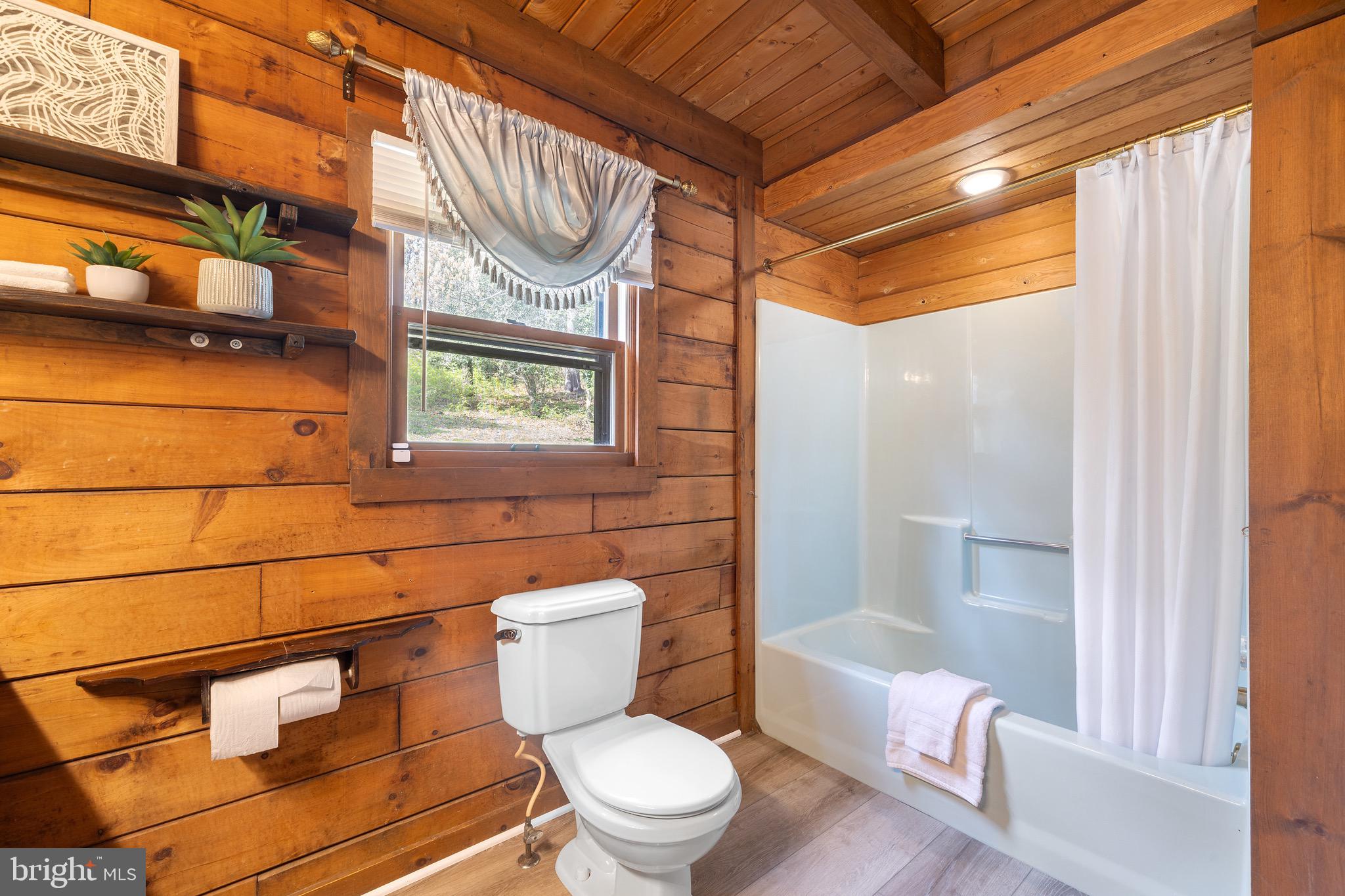 6402 Otis Street Cheverly, MD 20785 - Photo 15 of 52 a white toilet sitting next to a bathroom sink