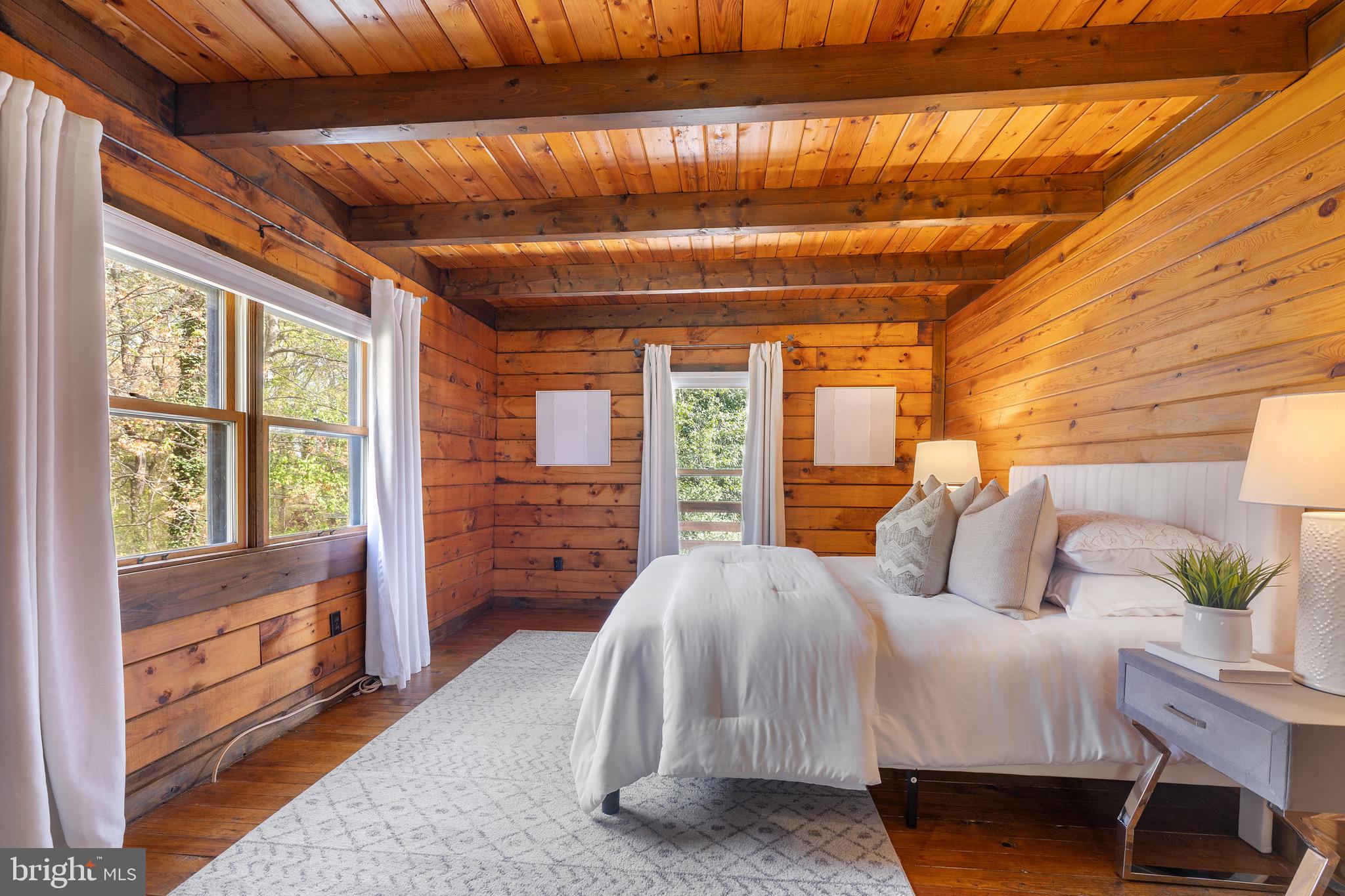 6402 Otis Street Cheverly, MD 20785 - Photo 17 of 52 a bedroom with a bed next to a window