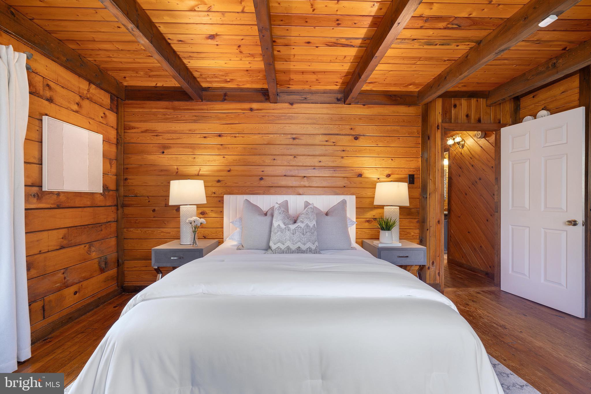 6402 Otis Street Cheverly, MD 20785 - Photo 18 of 52 a bedroom with a bed and a walk in closet