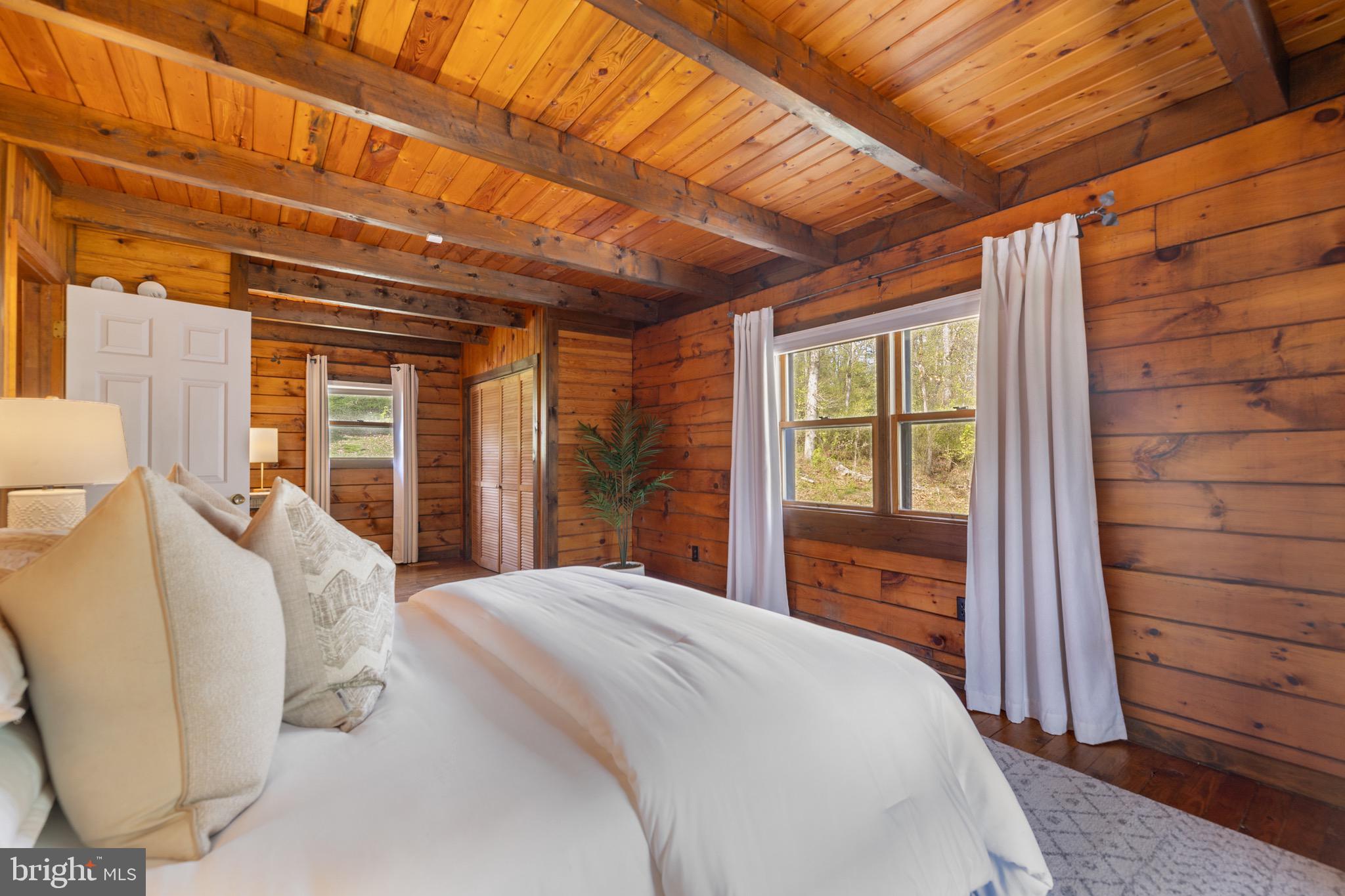6402 Otis Street Cheverly, MD 20785 - Photo 20 of 52 a bedroom with a bed and wooden floor