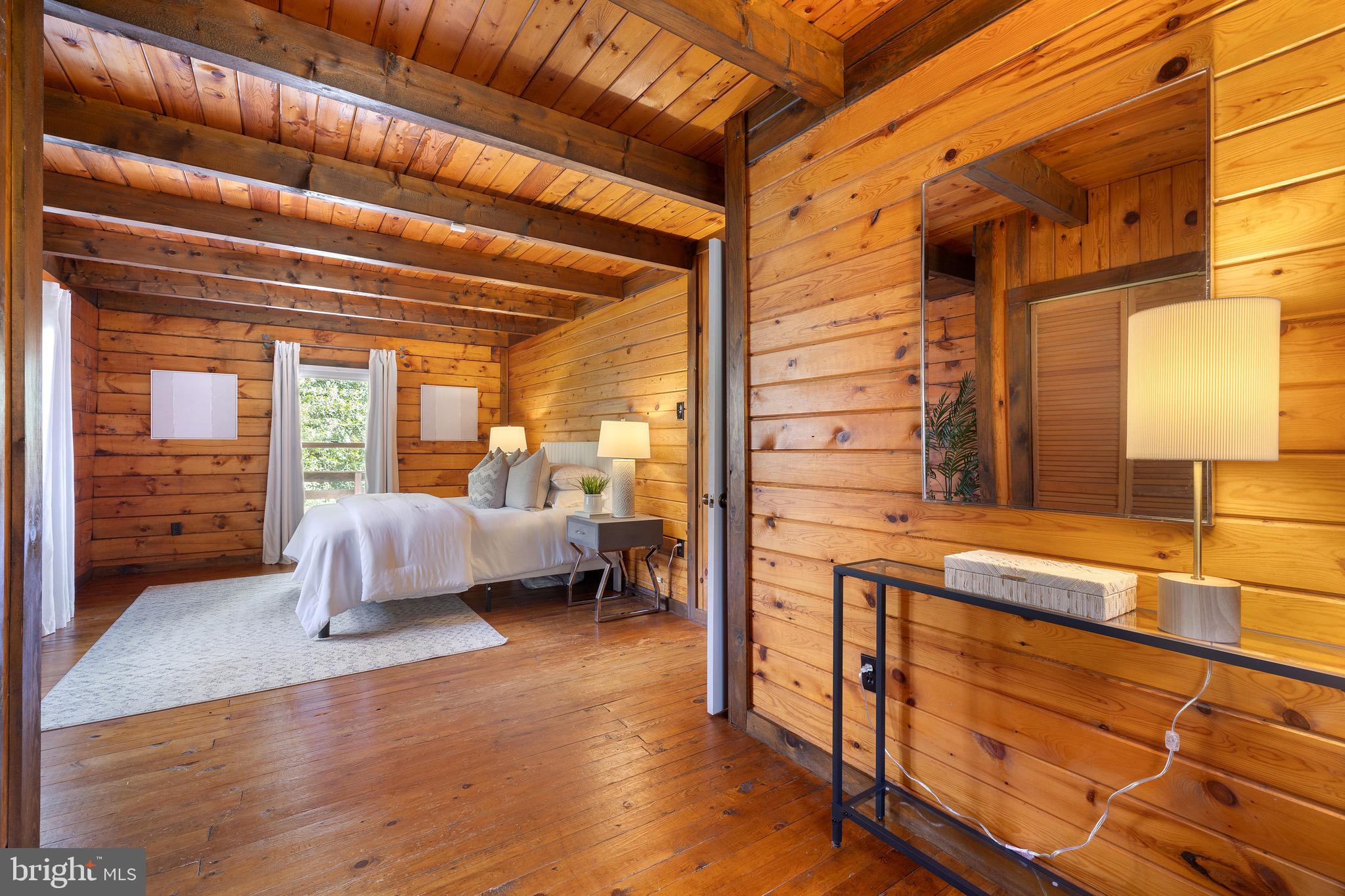 6402 Otis Street Cheverly, MD 20785 - Photo 22 of 52 a bedroom with furniture and a large window