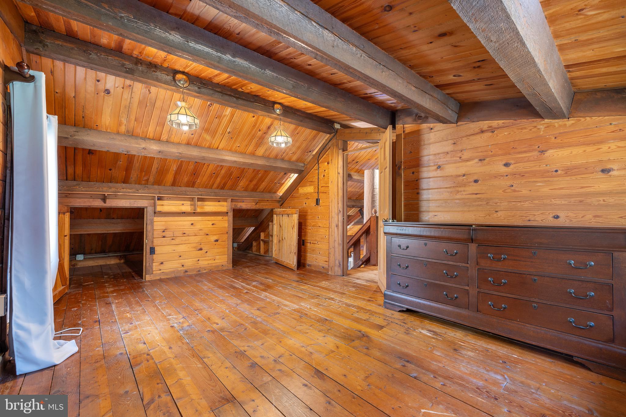 6402 Otis Street Cheverly, MD 20785 - Photo 24 of 52 a view of an empty room with wooden floor and a window
