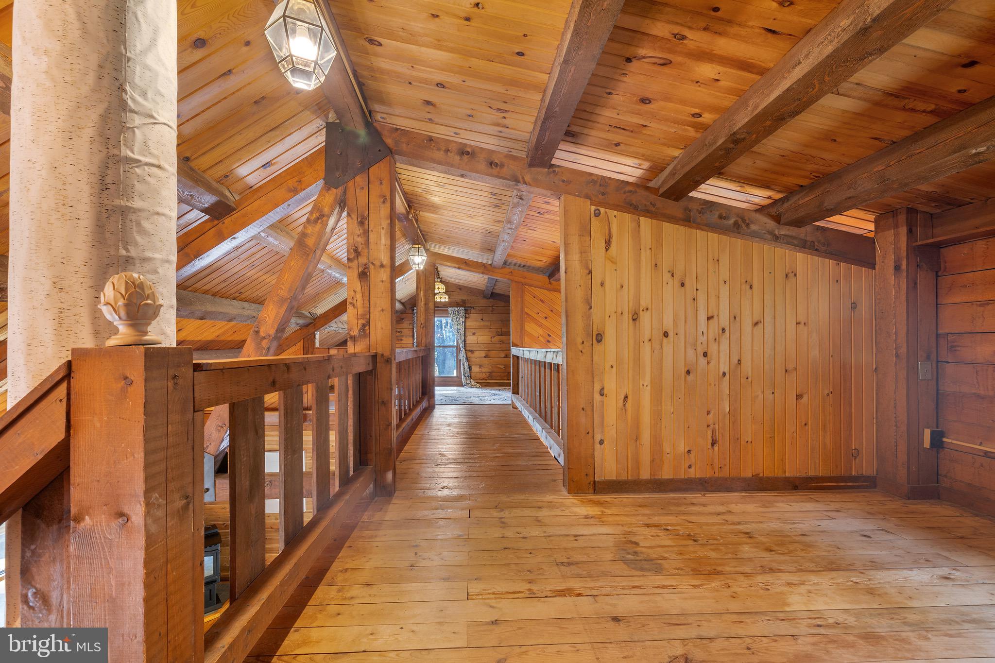 6402 Otis Street Cheverly, MD 20785 - Photo 26 of 52 a view of a hallway with wooden floor