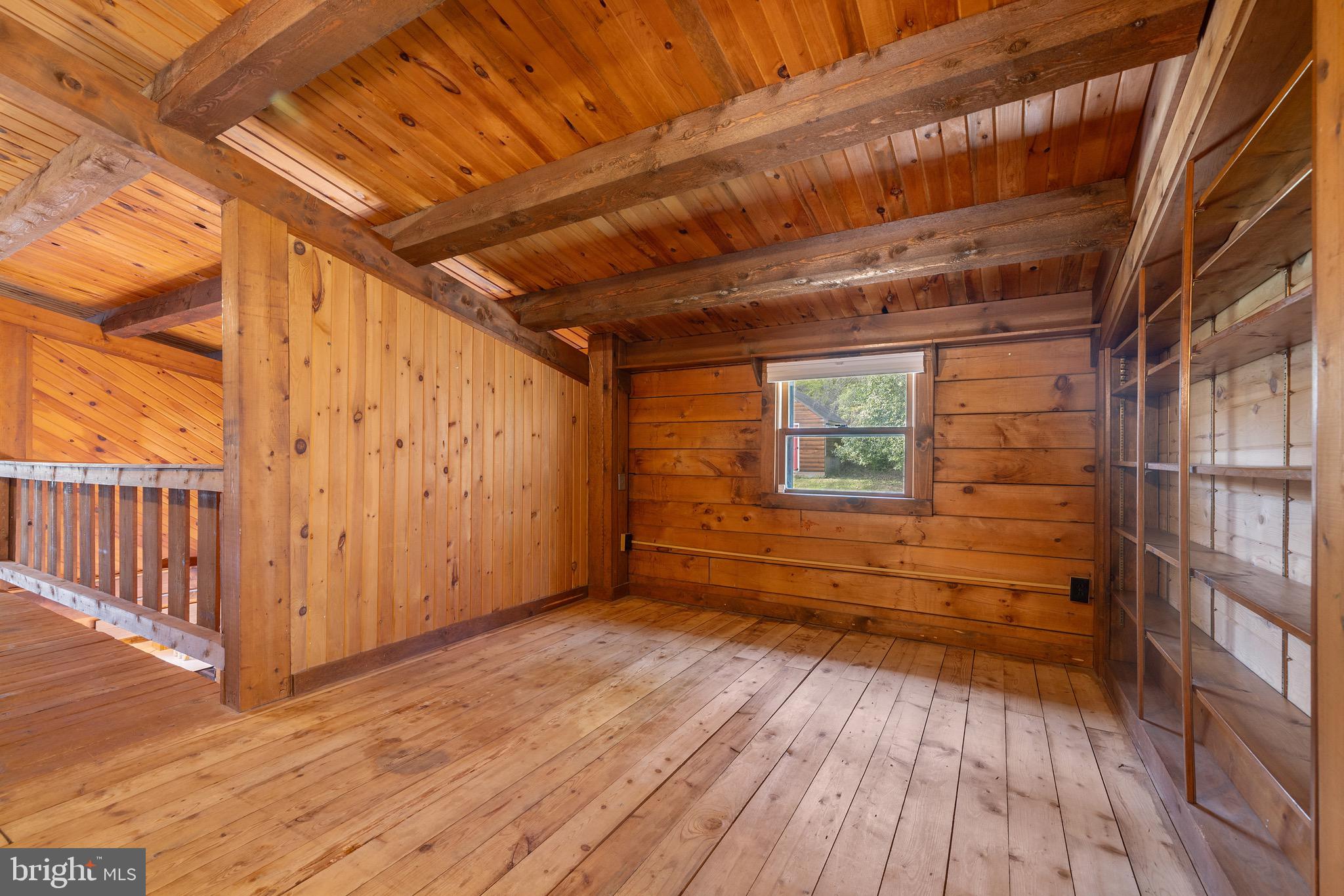 6402 Otis Street Cheverly, MD 20785 - Photo 27 of 52 a view of an empty room with wooden floor and a window