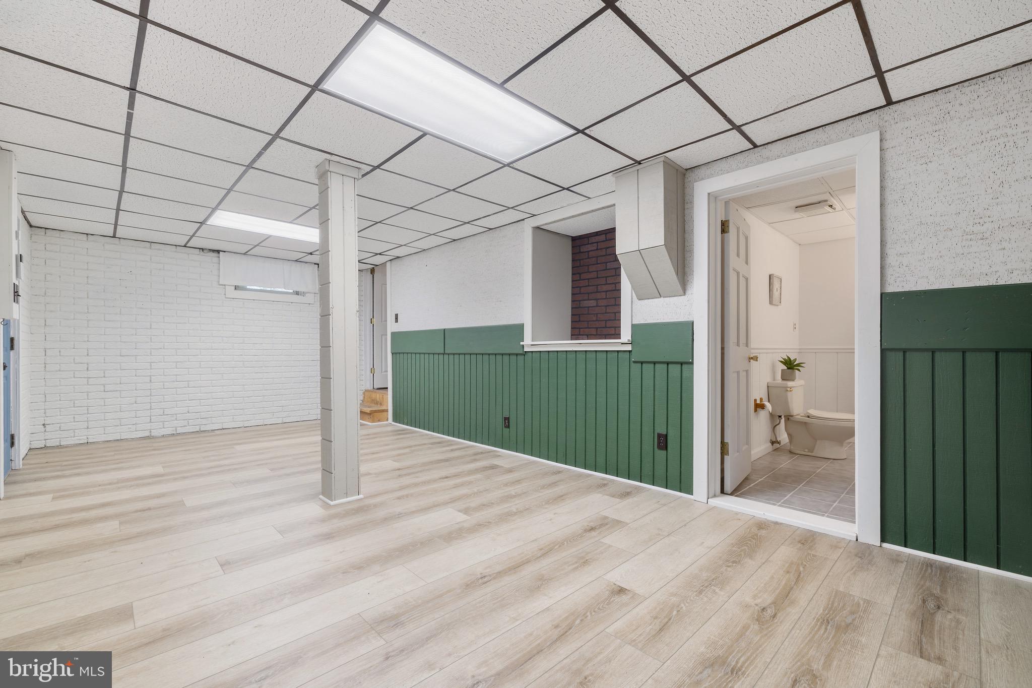 6402 Otis Street Cheverly, MD 20785 - Photo 34 of 52 a view of a big room with wooden floor and entryway