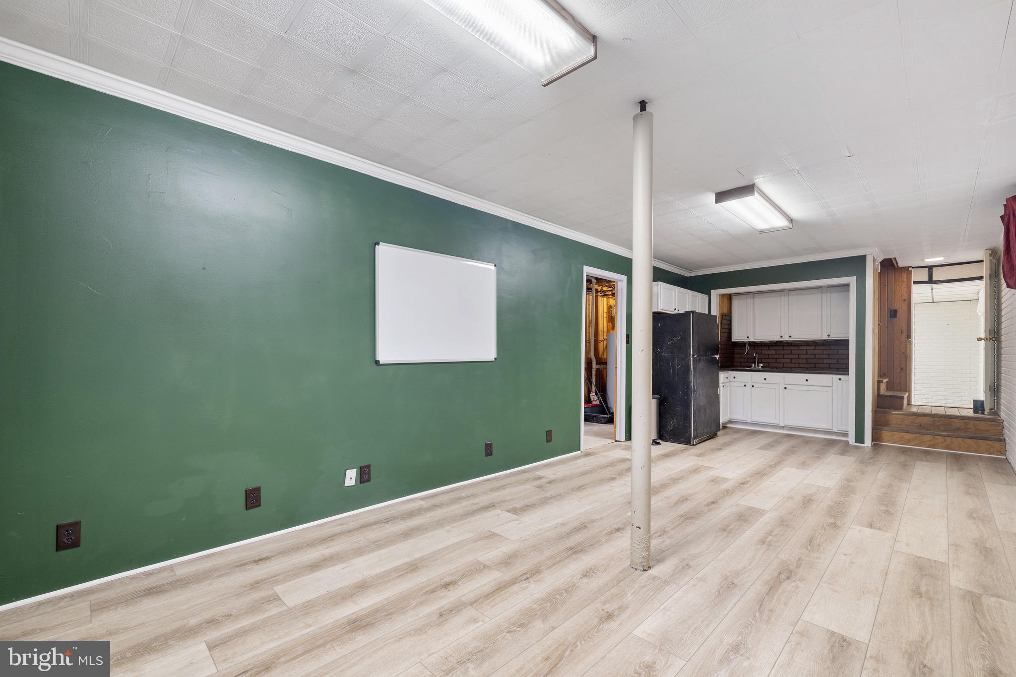 6402 Otis Street Cheverly, MD 20785 - Photo 39 of 52 a view of empty room with wooden floor