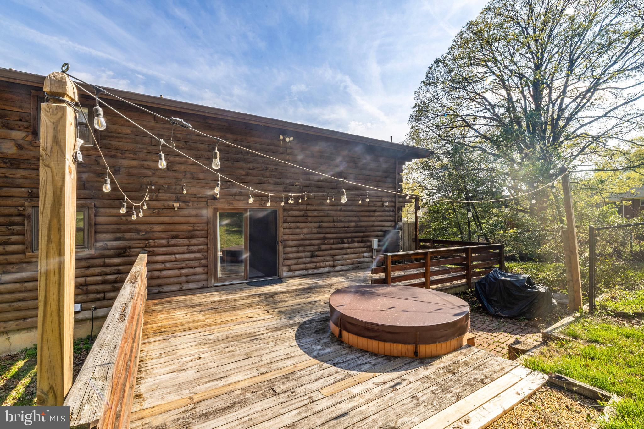 6402 Otis Street Cheverly, MD 20785 - Photo 45 of 52 a backyard of house with table and chairs and potted plants