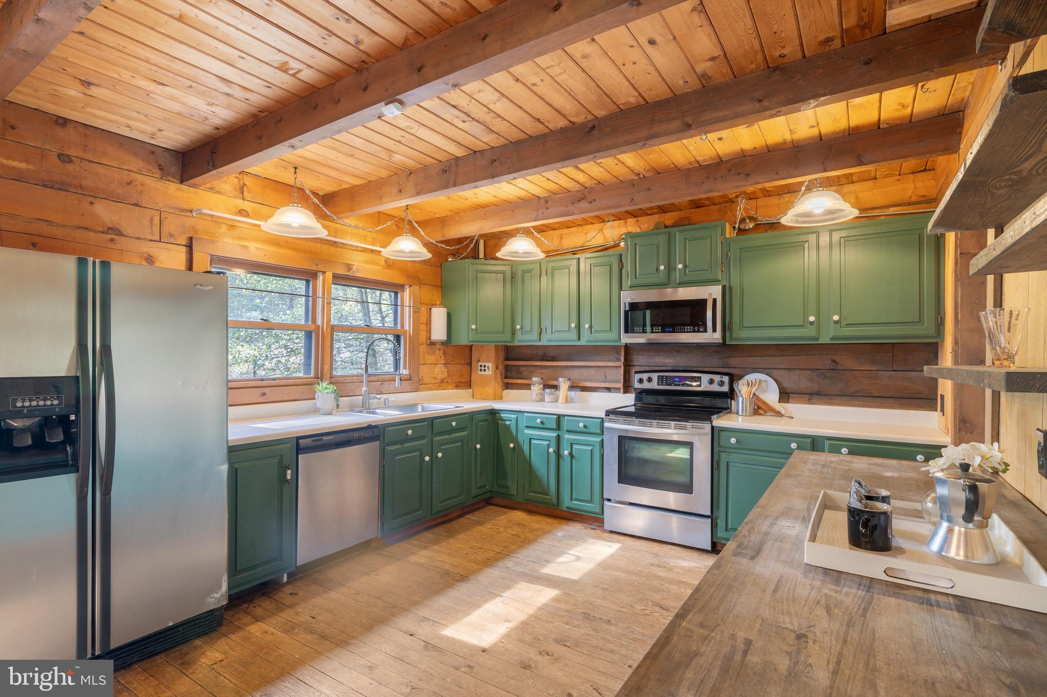 6402 Otis Street Cheverly, MD 20785 - Photo 8 of 52 a kitchen with stainless steel appliances granite countertop a sink and a stove top oven