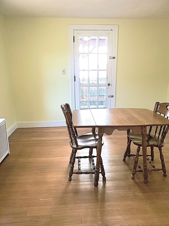 54 Ashbrook Street Springfield, MA 01118 - Photo 8 of 30 a view of a dining room with furniture and wooden floor