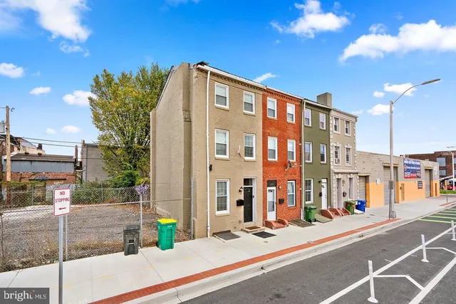 a front view of a building with street view
