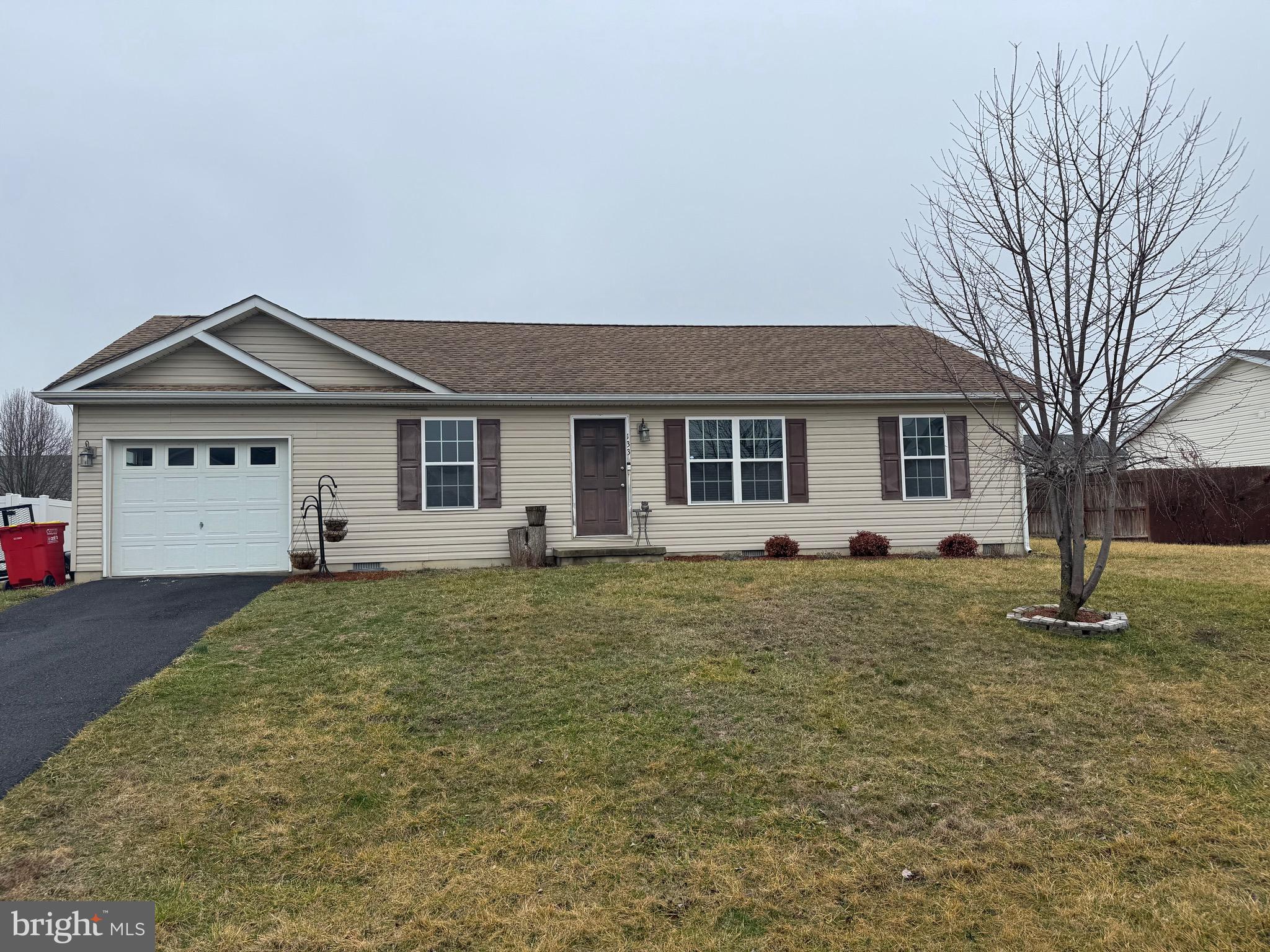 133 Wallace Avenue Inwood, WV 25428 - Photo 1 of 1 a view of a house with a yard and large tree