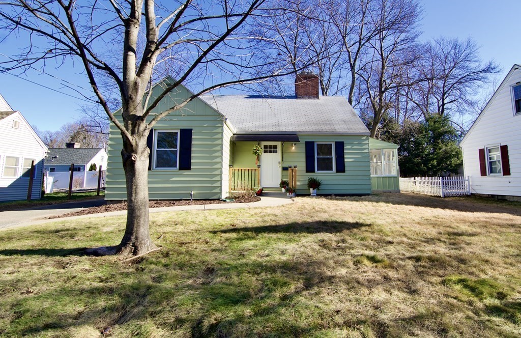 71 Mayflower Road Springfield, MA 01118 - Photo 1 of 42 a front view of a house with a yard covered in snow