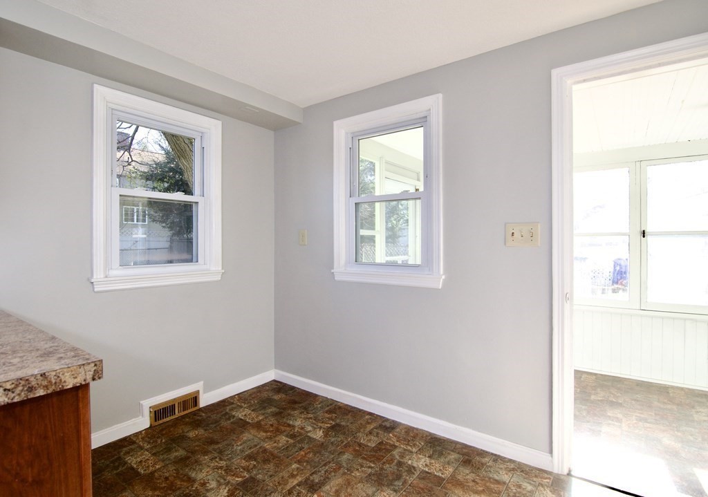 71 Mayflower Road Springfield, MA 01118 - Photo 12 of 42 a view of empty room with window and wooden floor