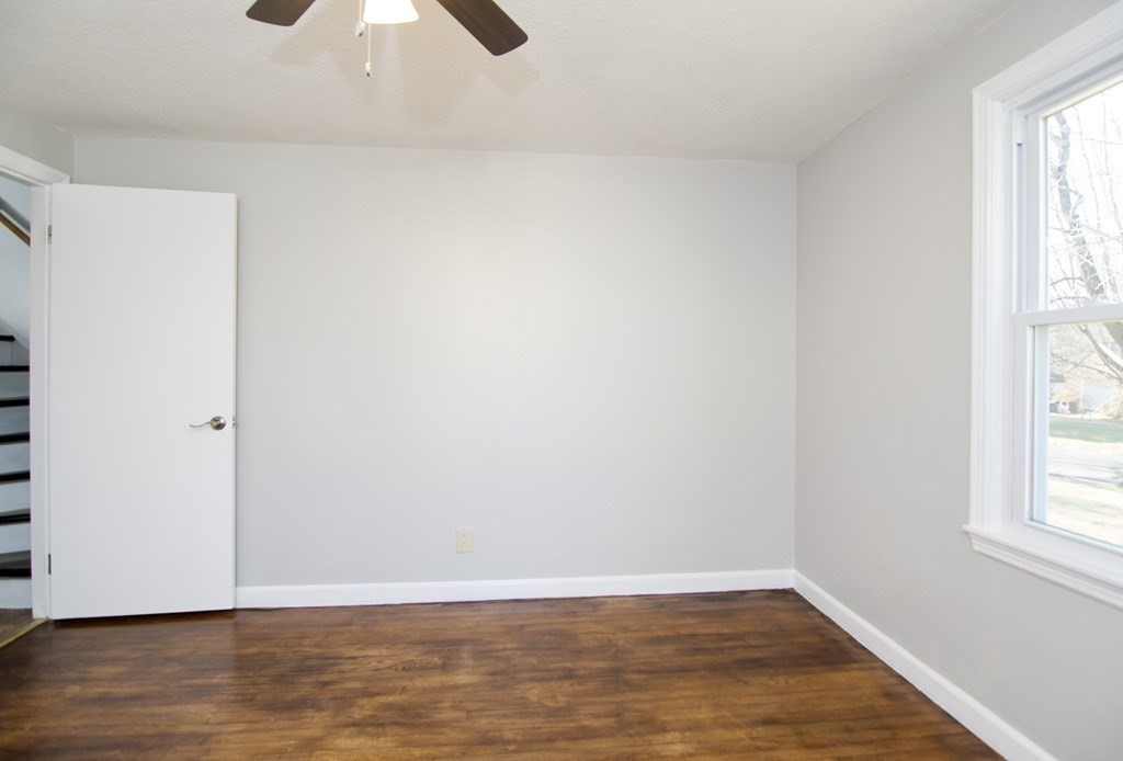 71 Mayflower Road Springfield, MA 01118 - Photo 28 of 42 an empty room with wooden floor and windows