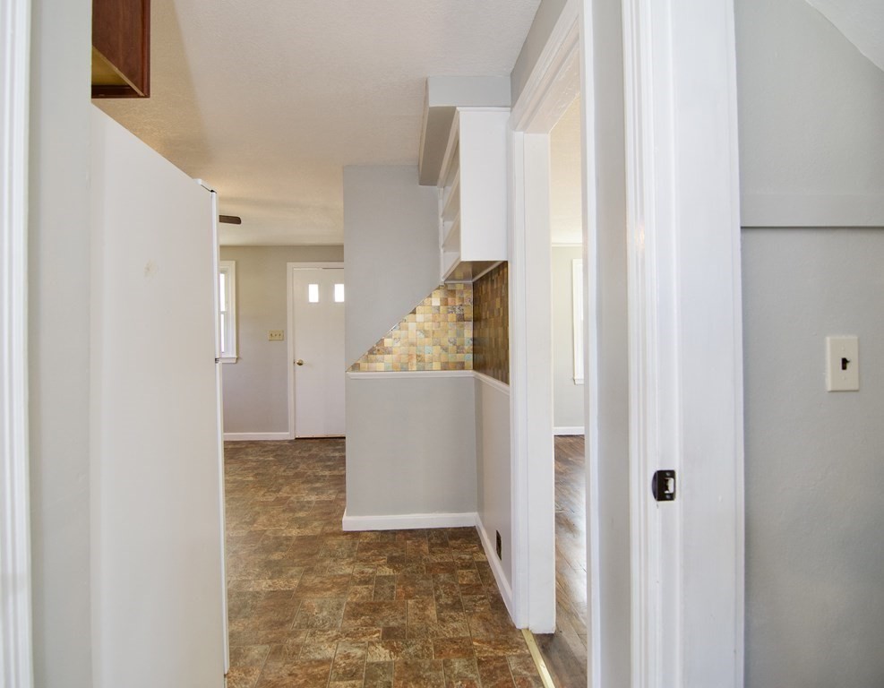 71 Mayflower Road Springfield, MA 01118 - Photo 39 of 42 a view of a hallway with white walls and entryway