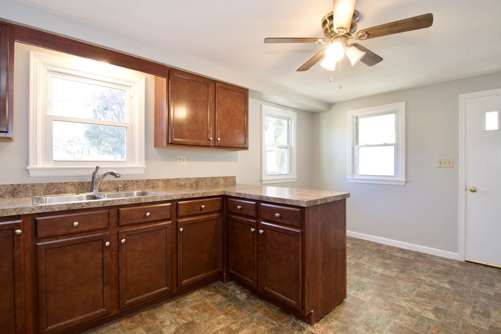 71 Mayflower Road Springfield, MA 01118 - Photo 8 of 42 a kitchen with sink cabinets and window