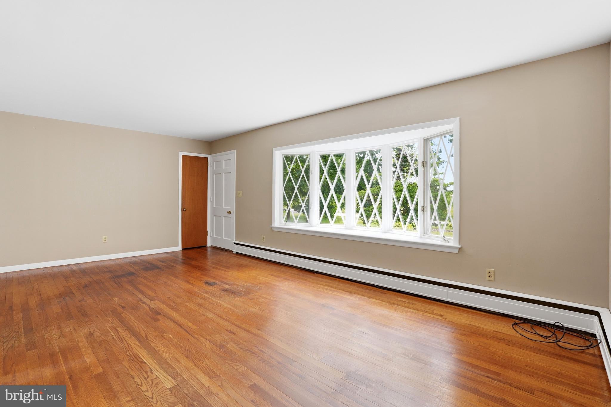 486 Derstine Road Hatfield, PA 19440 - Photo 7 of 53 an empty room with wooden floor and windows