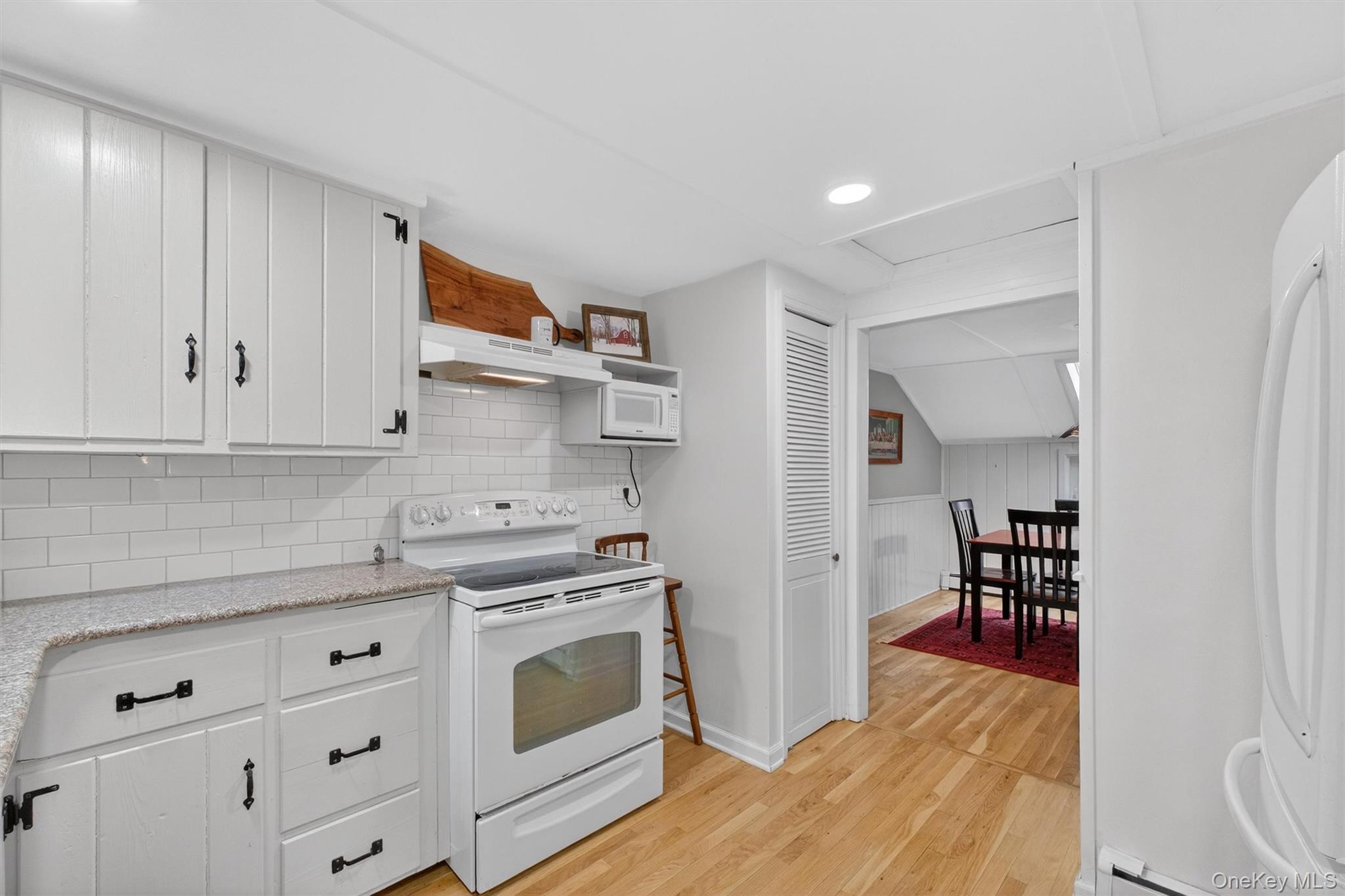 3 Camden Road Brewster, NY 10509 - Photo 14 of 39 a kitchen with stainless steel appliances granite countertop a stove and a refrigerator