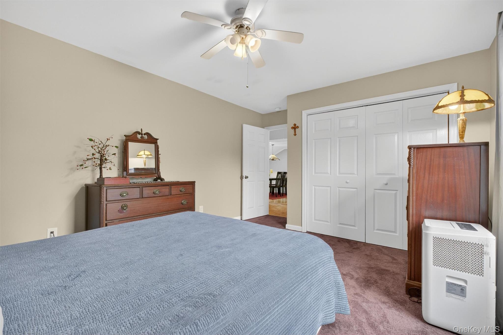 3 Camden Road Brewster, NY 10509 - Photo 25 of 39 a large bedroom with a bed and a chandelier