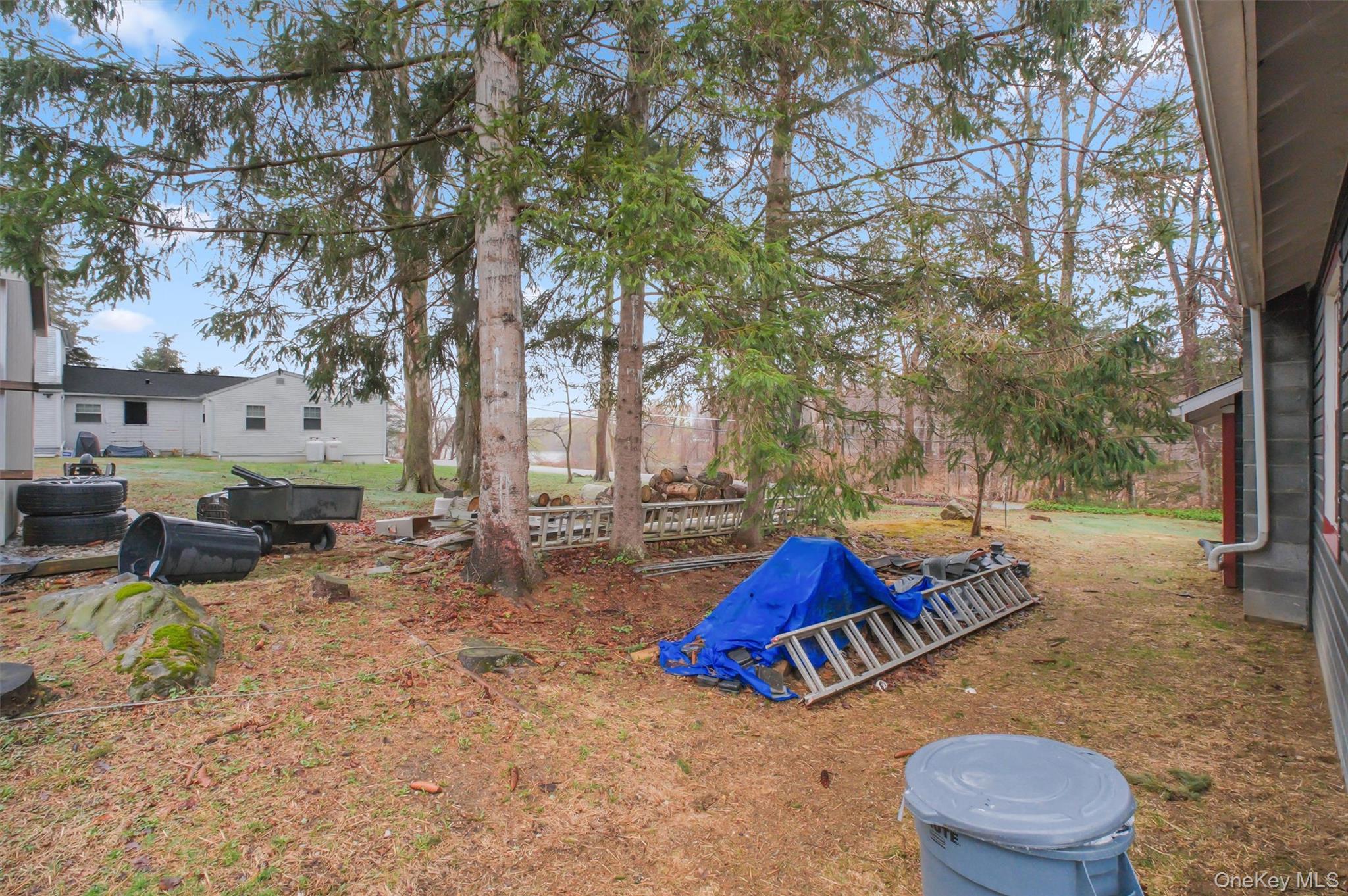 3 Camden Road Brewster, NY 10509 - Photo 34 of 39 a backyard of a house with barbeque oven table and chairs