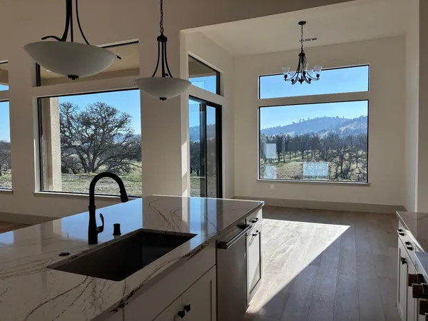 a spacious bathroom with a bathtub and sink