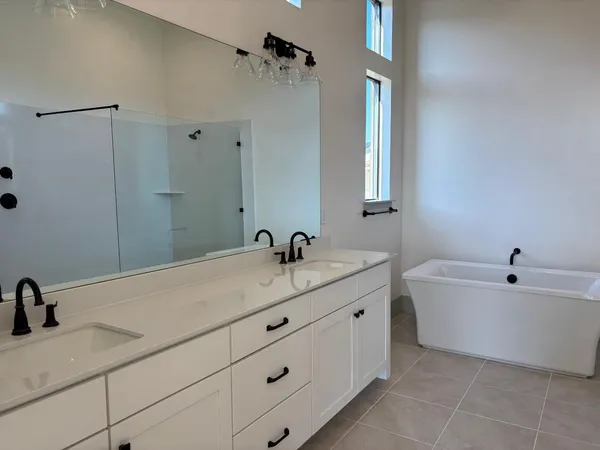 a white toilet sitting next to a shower