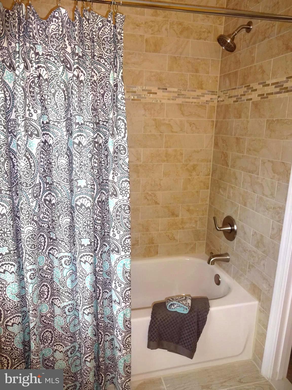7800 Fairgreen Road Baltimore, MD 21222 - Photo 11 of 24 Updated Full Master Bath offering Ceramic Tile
