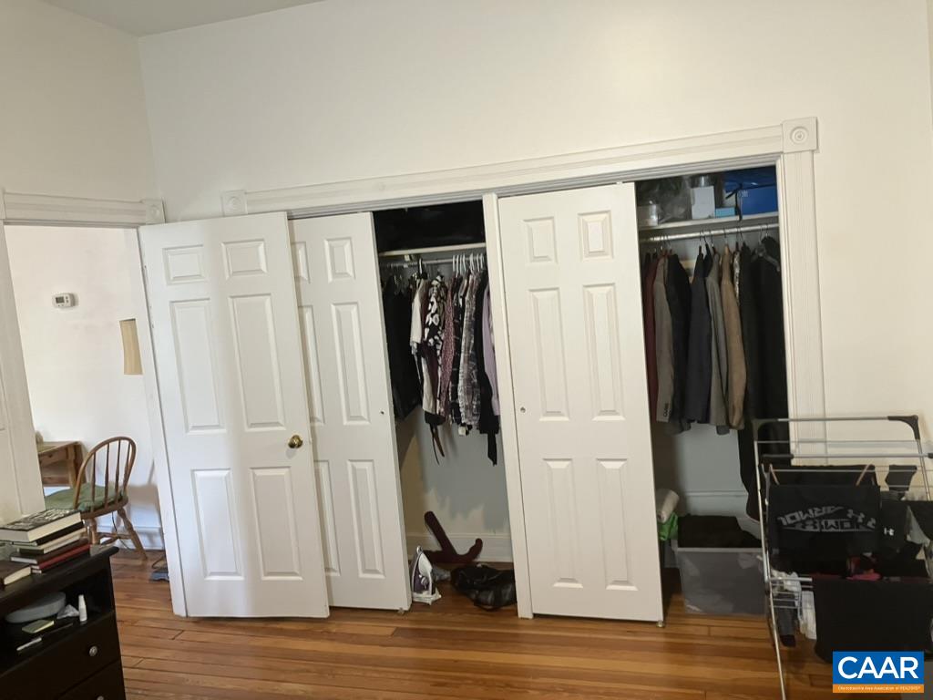 711 West Main Street, Unit B Charlottesville, VA 22903 - Photo 4 of 7 a view of a livingroom with wooden floor and closet