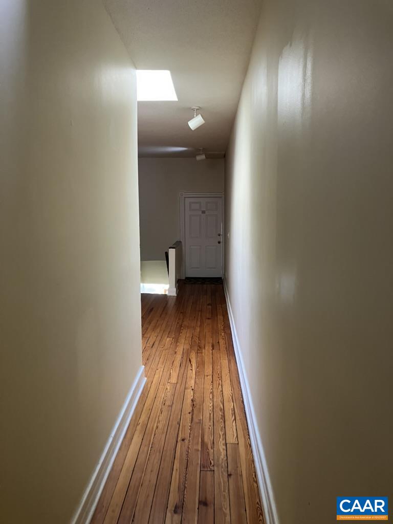 711 West Main Street, Unit B Charlottesville, VA 22903 - Photo 6 of 7 a view of a hallway with wooden floor